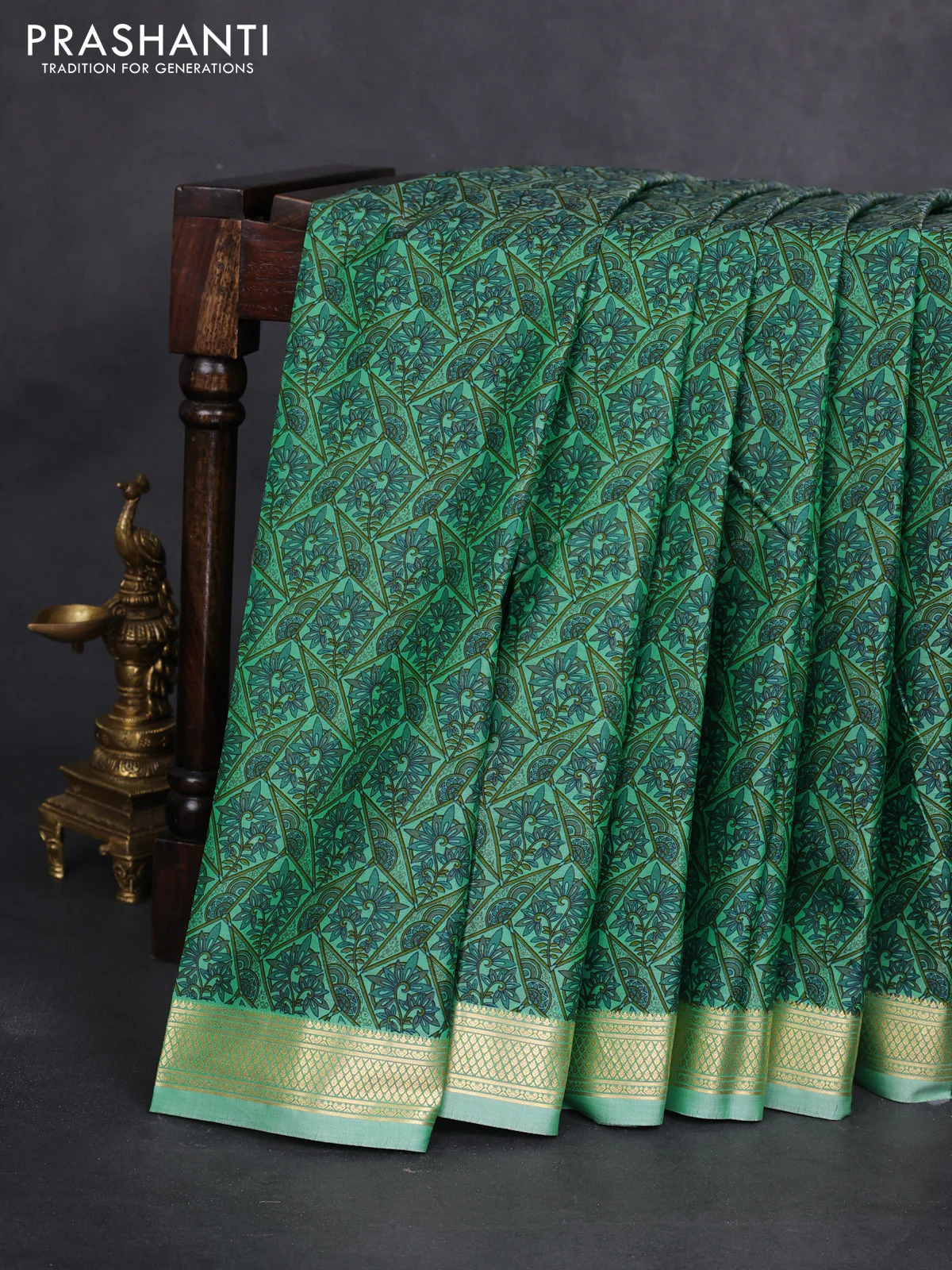 Printed silk saree pastel green with allover prints and zari woven border