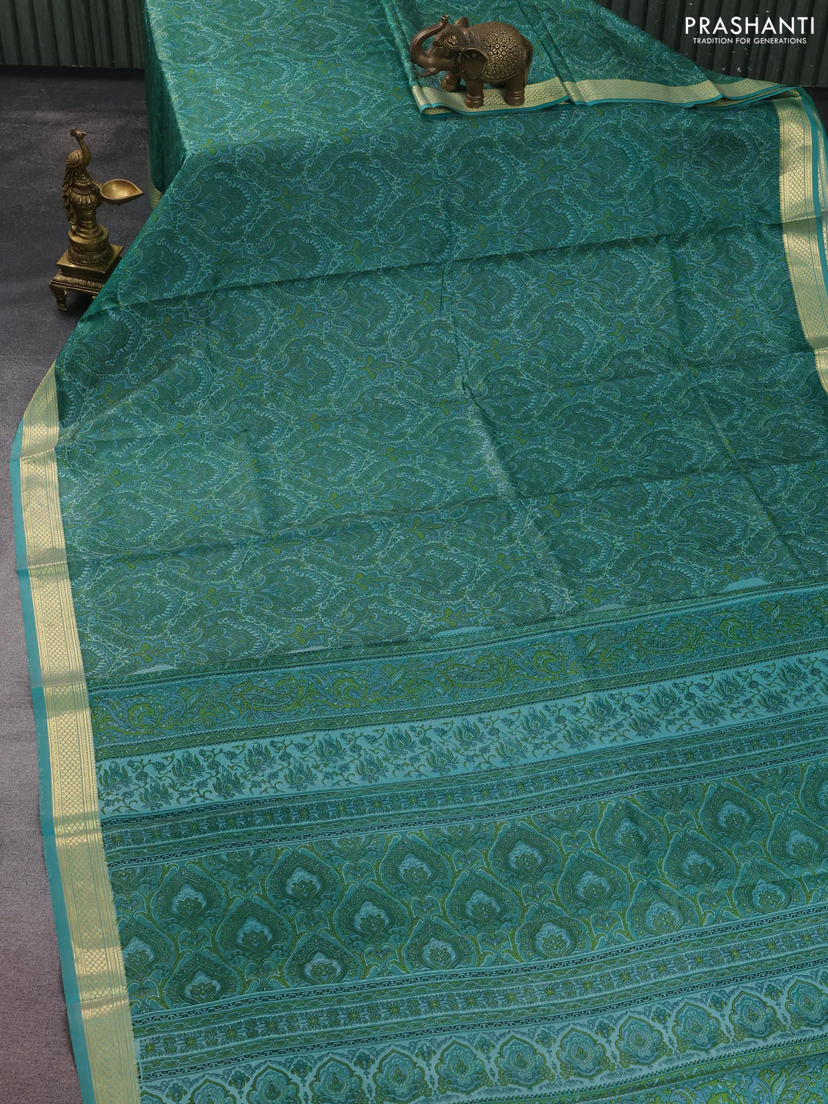 Printed silk saree teal blue with allover prints and zari woven border - Image 2