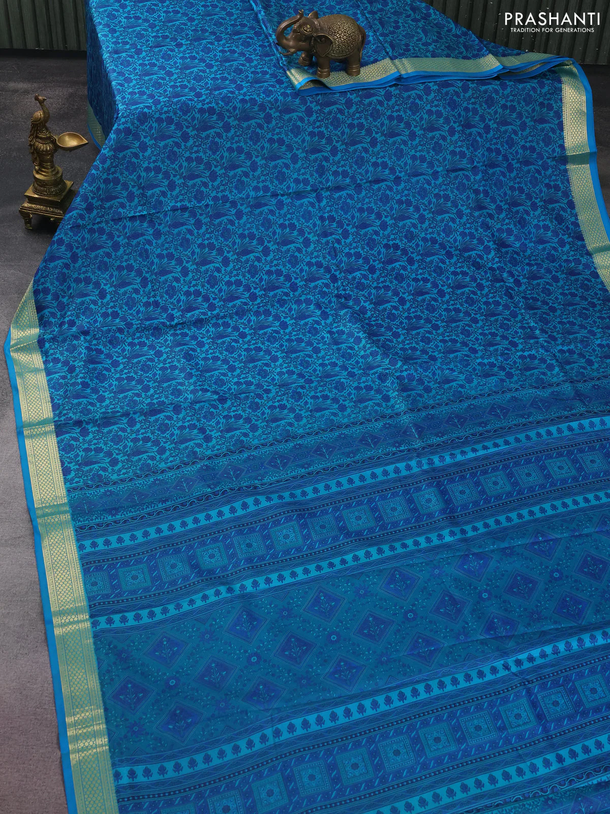 Printed silk saree teal blue with allover prints and zari woven border - Image 2