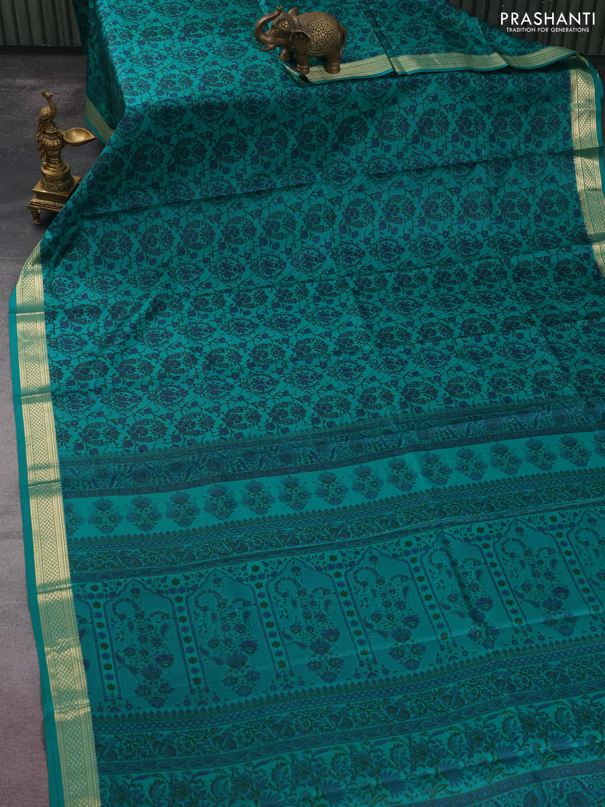Printed silk saree teal green with allover prints and zari woven border - Image 2