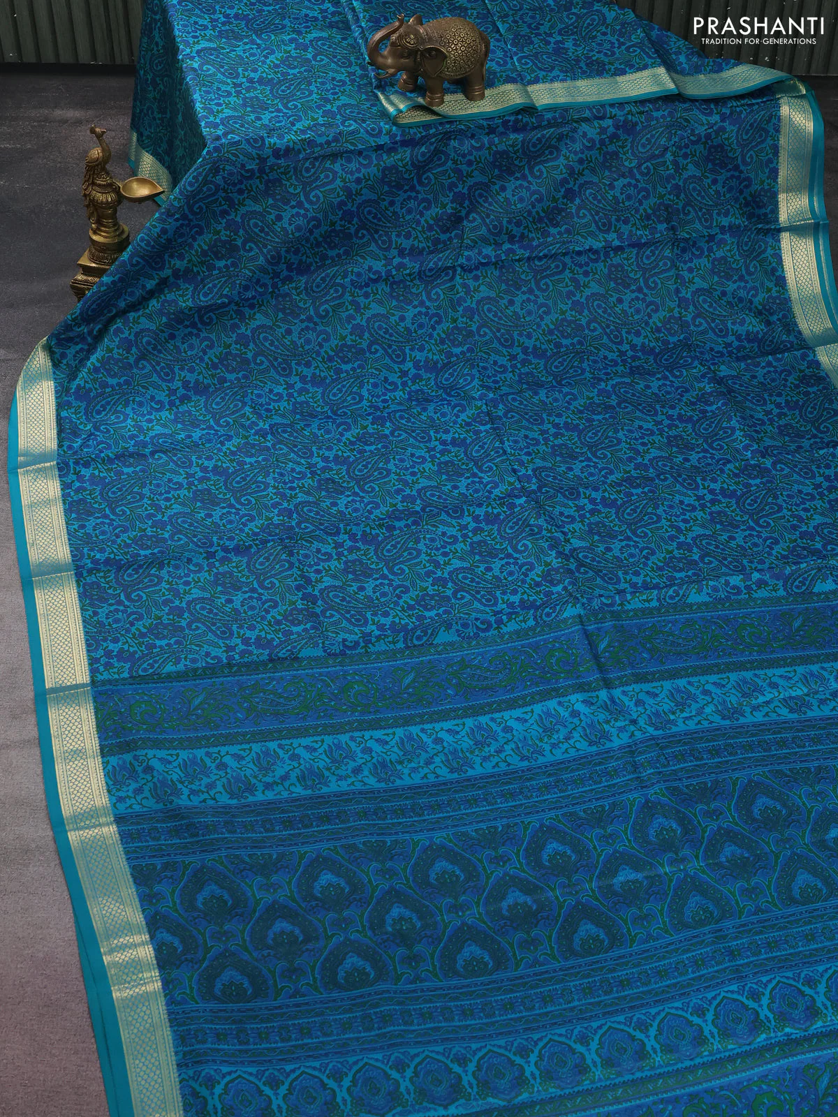 Printed silk saree teal green with allover prints and zari woven border - Image 2