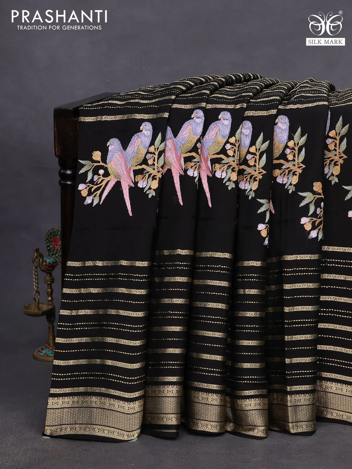 Pure crepe saree black with allover zari weaves & embroidery work and zari woven border