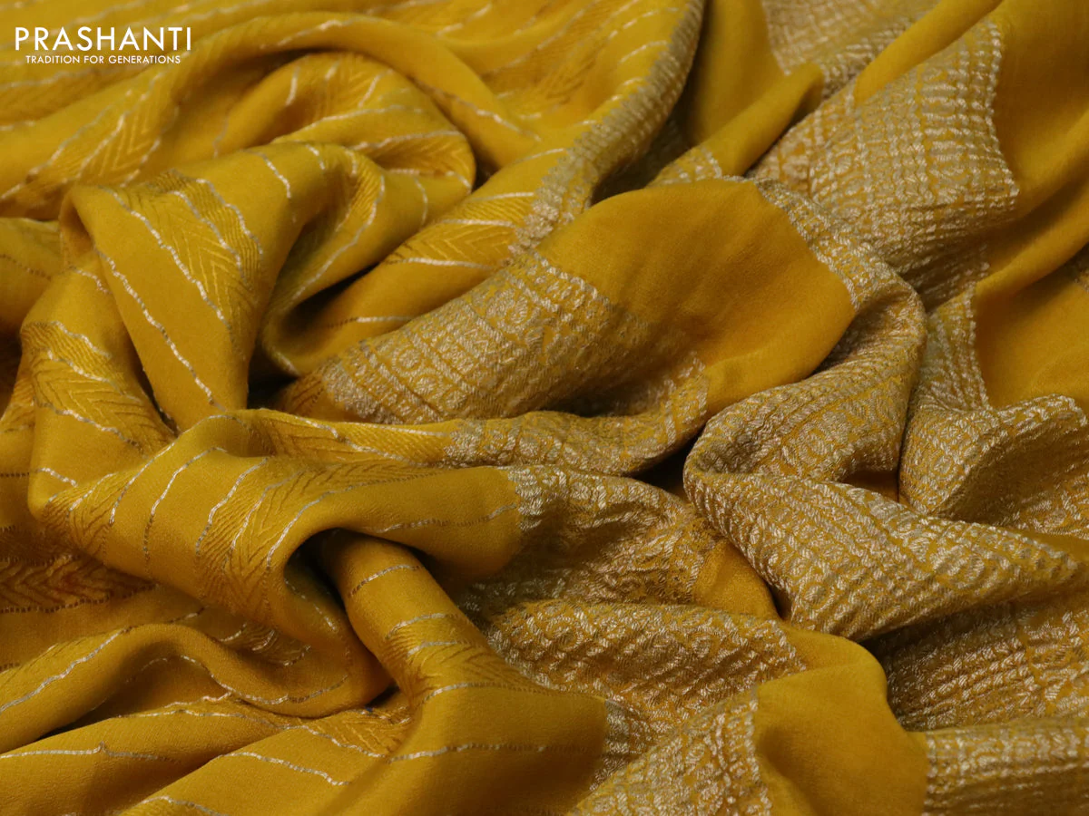 Pure crepe saree mustard yellow with allover zari weaves & embroidery work and zari woven border - Image 3