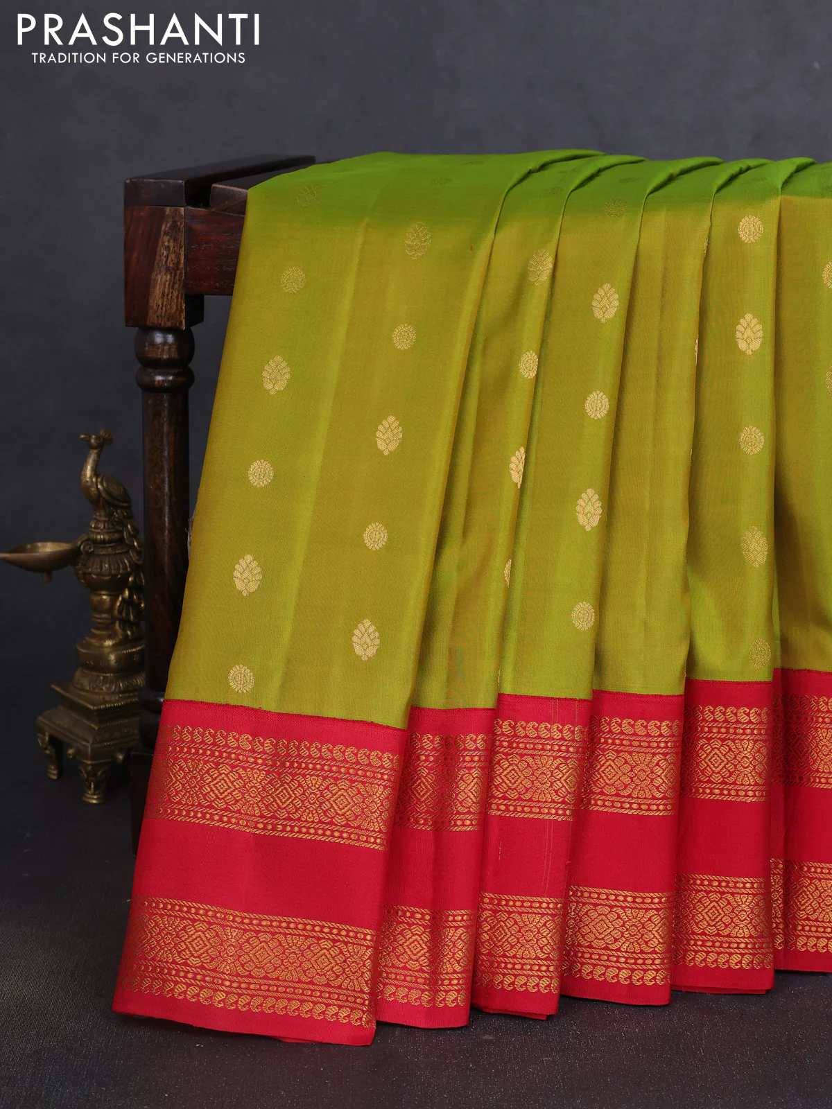 Pure gadwal silk saree dual shade of light green and red with zari woven buttas and temple design zari woven border