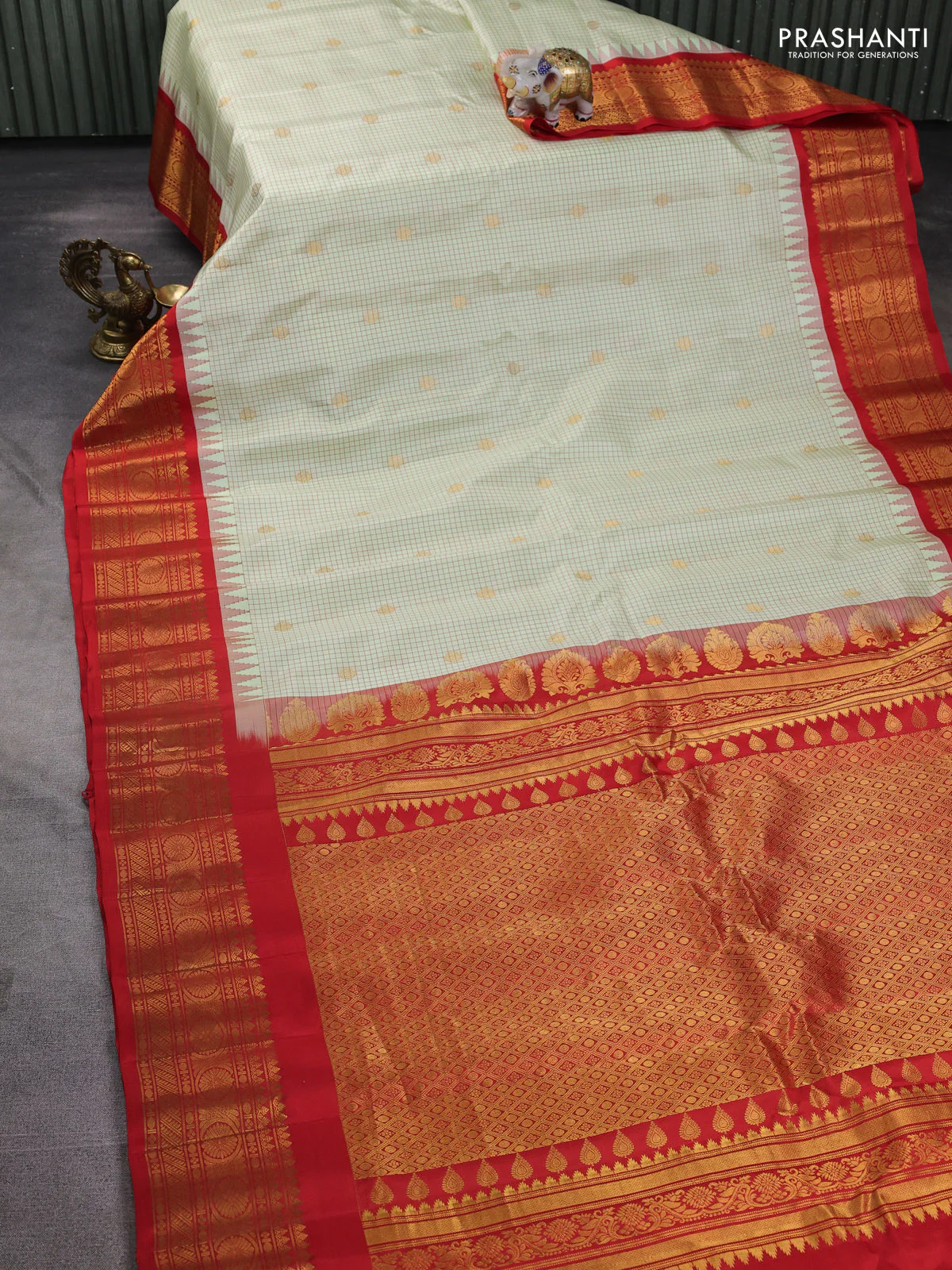 Pure gadwal silk saree mild pista green and orange with allover checks & zari buttas and temple design zari woven border - Image 2