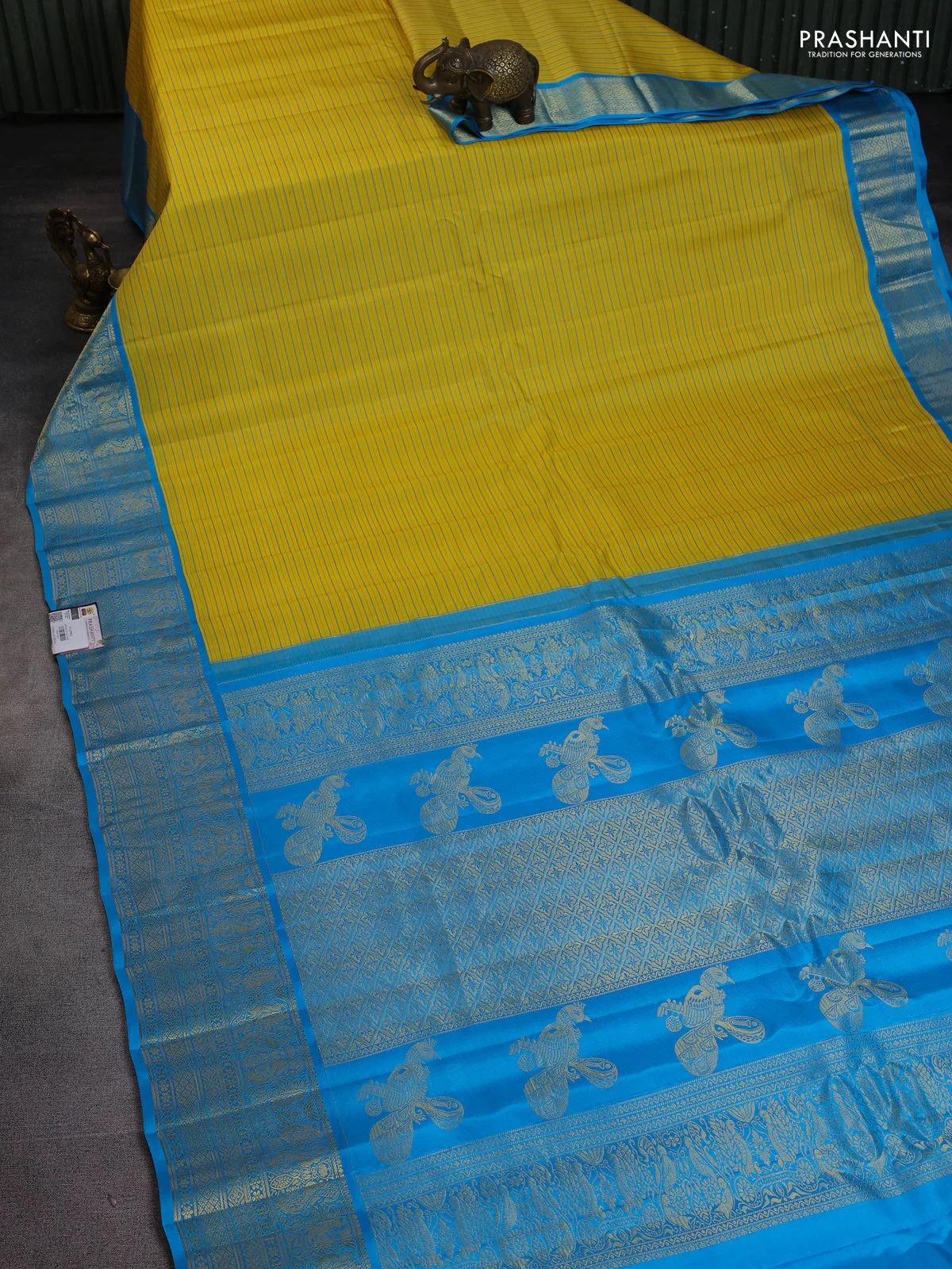 Pure gadwal silk saree yellow and light blue with allover stripe pattern and rich zari woven border - Image 2