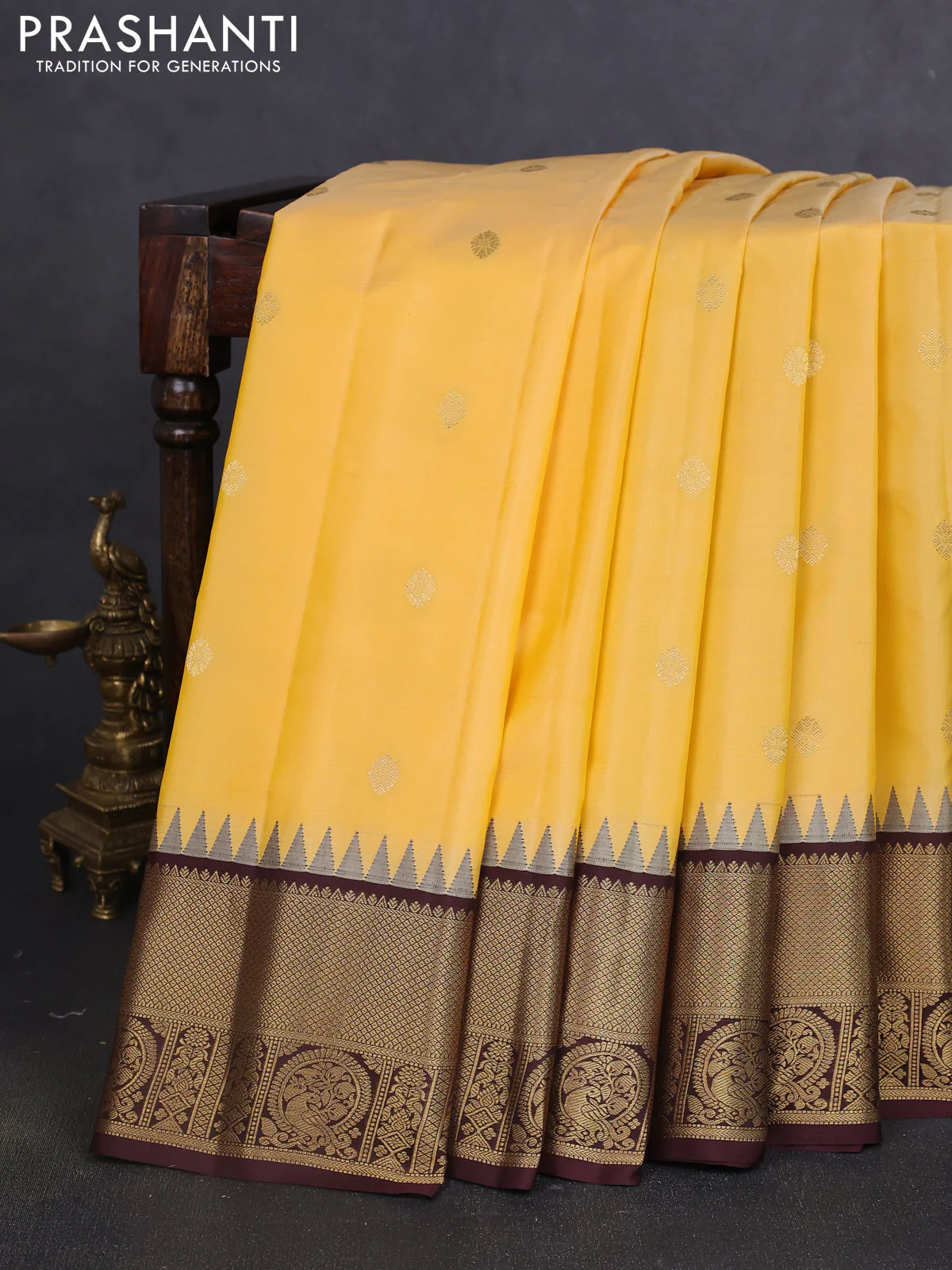 Pure gadwal silk saree yellow shade and coffee brown with zari woven buttas and temple design zari woven border