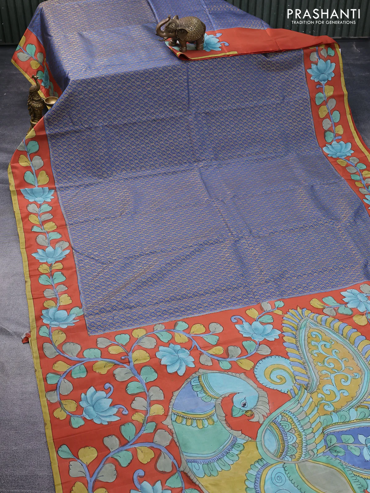 Pure kanchipuram silk saree blue shade and rustic orange with allover zari woven brocade weaves and kalamkari printed pallu & border - Image 2