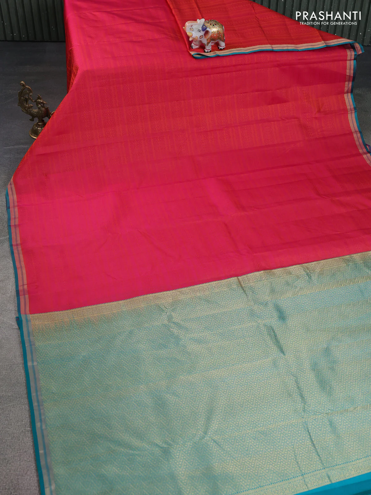 Pure kanchipuram silk saree dual shade of pinkish orange and teal green with allover self emboss and zari woven border - Image 2