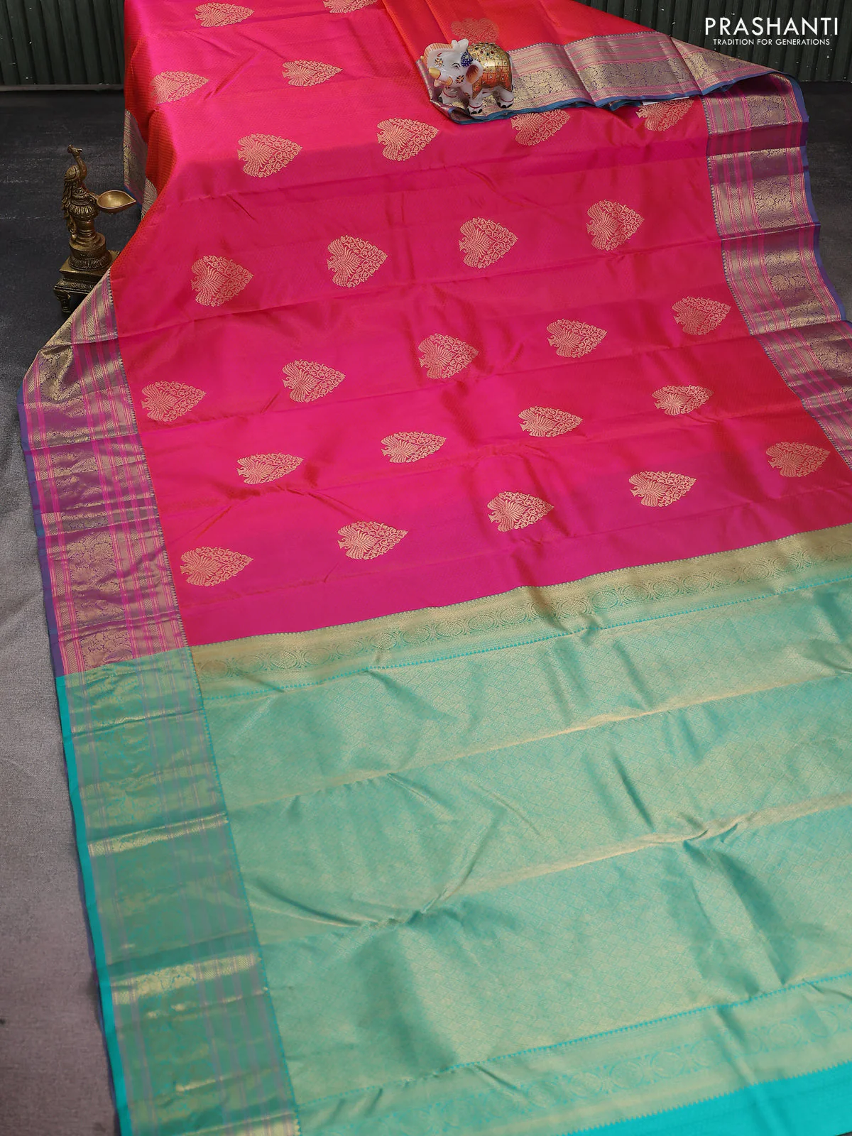 Pure kanchipuram silk saree dual shade of pinkish orange and teal green with allover self emboss & zari buttas and zari woven floral border - Image 2
