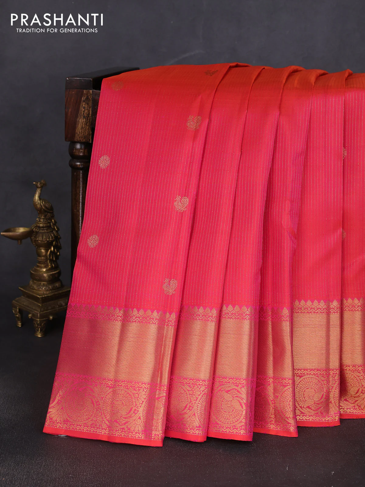 Pure kanchipuram silk saree dual shade of pinkish orange with allover zari weaves & buttas and long zari woven border