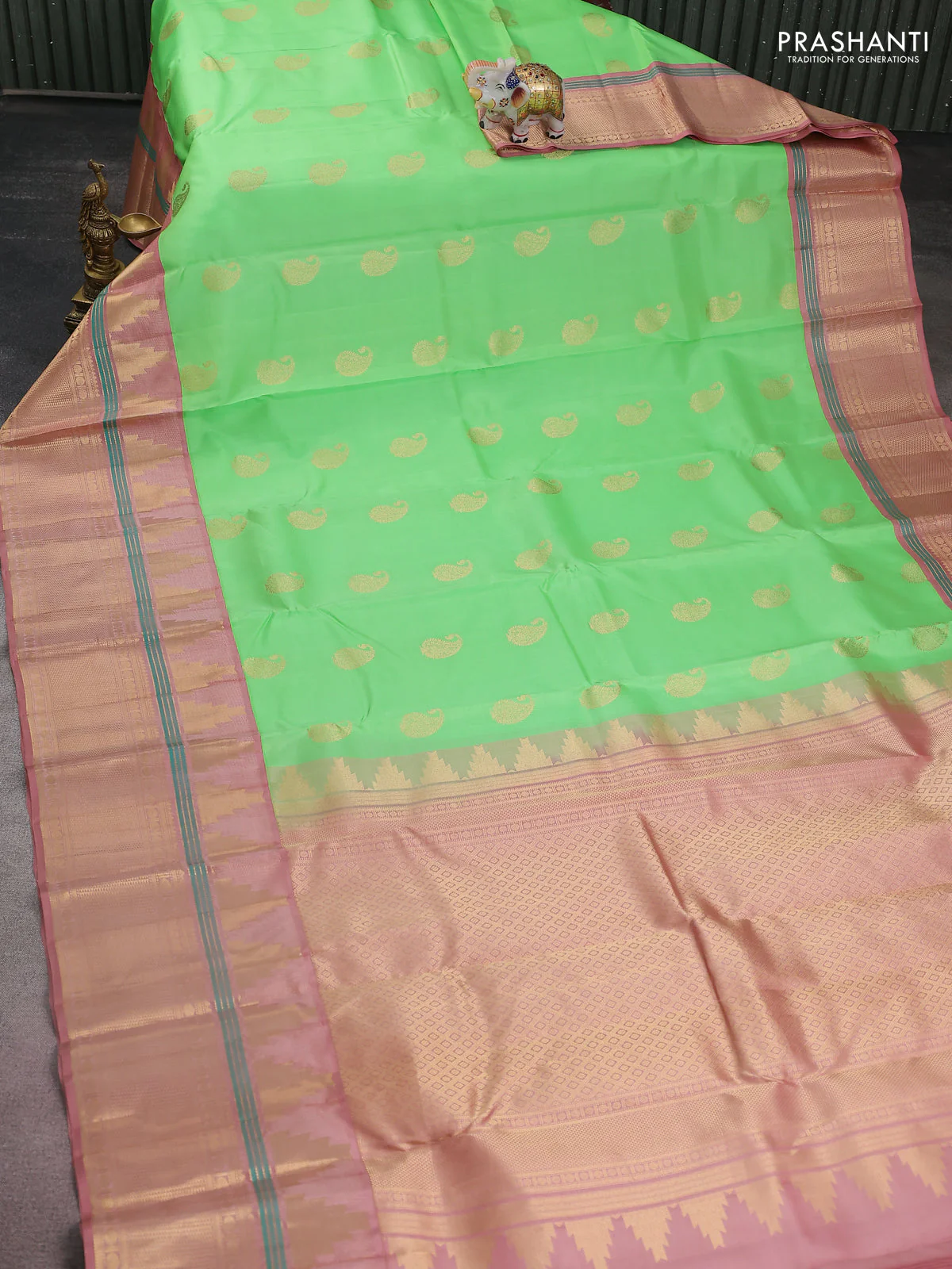 Pure kanchipuram silk saree green shade and pastel peach with paisley zari woven buttas and long temple design zari woven korvai border - Image 2