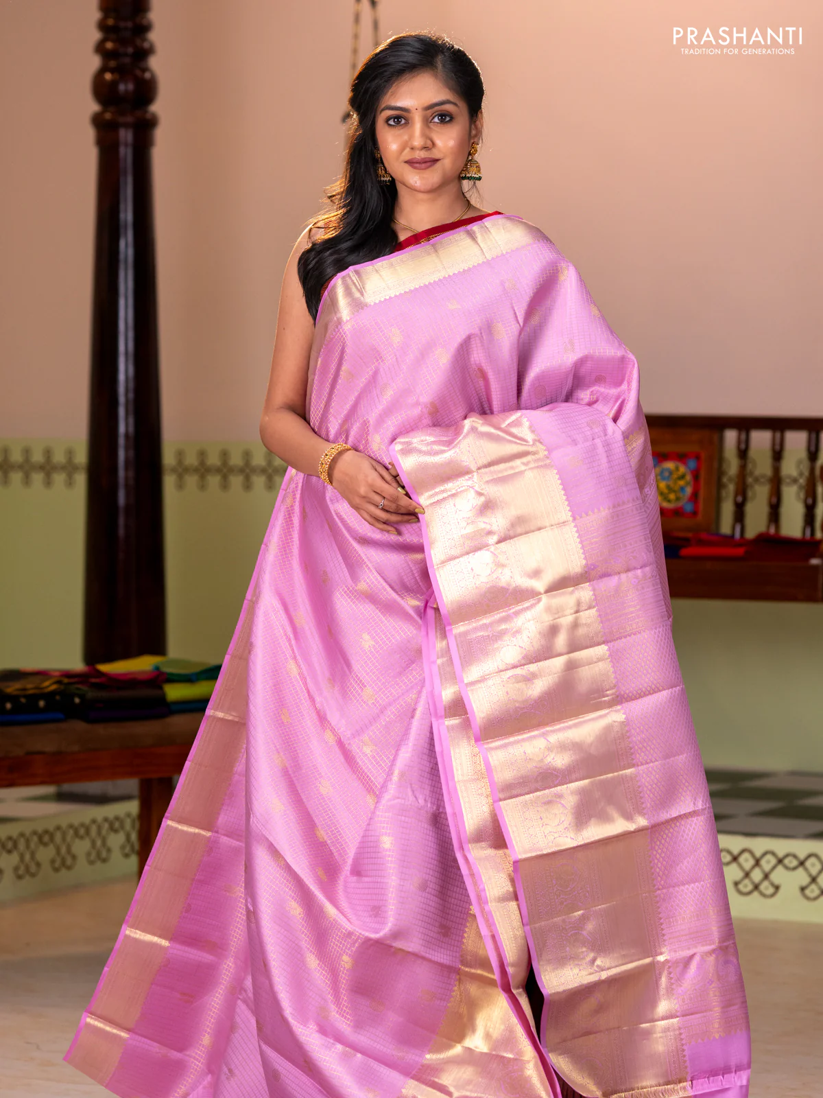 Pure kanchipuram silk saree light pink with allover zari checks & buttas and long zari woven border