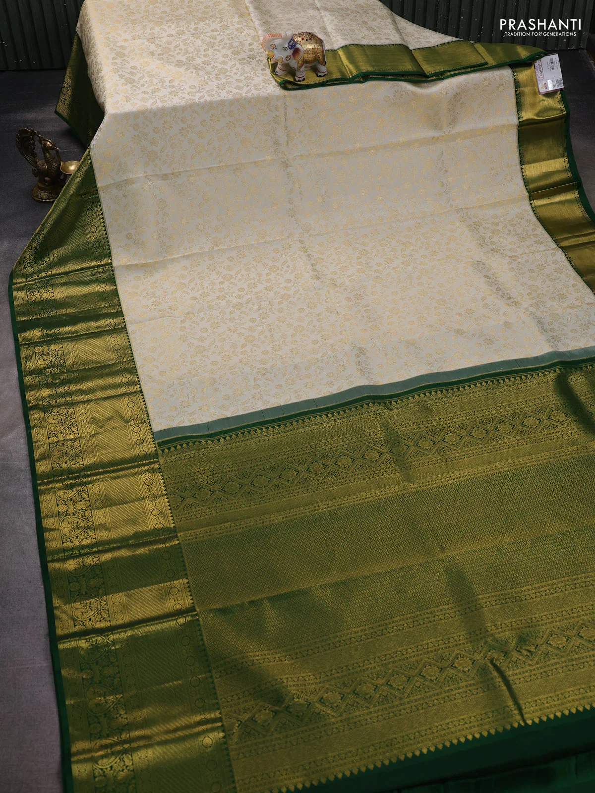Pure kanchipuram silk saree off white and green with allover zari woven brocade weaves and zari woven border - Image 2