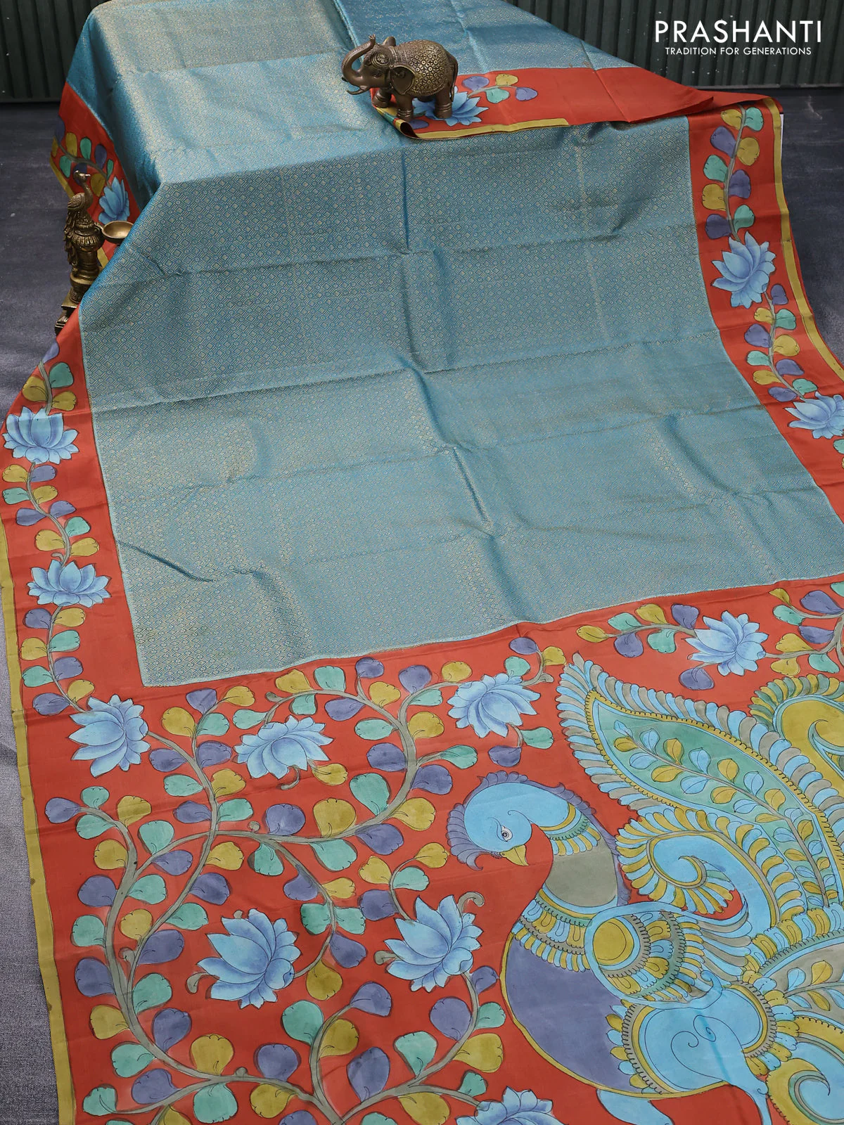Pure kanchipuram silk saree pastel blue and rustic orange with allover zari woven geometric brocade weaves and kalamkari printed pallu & border - Image 2