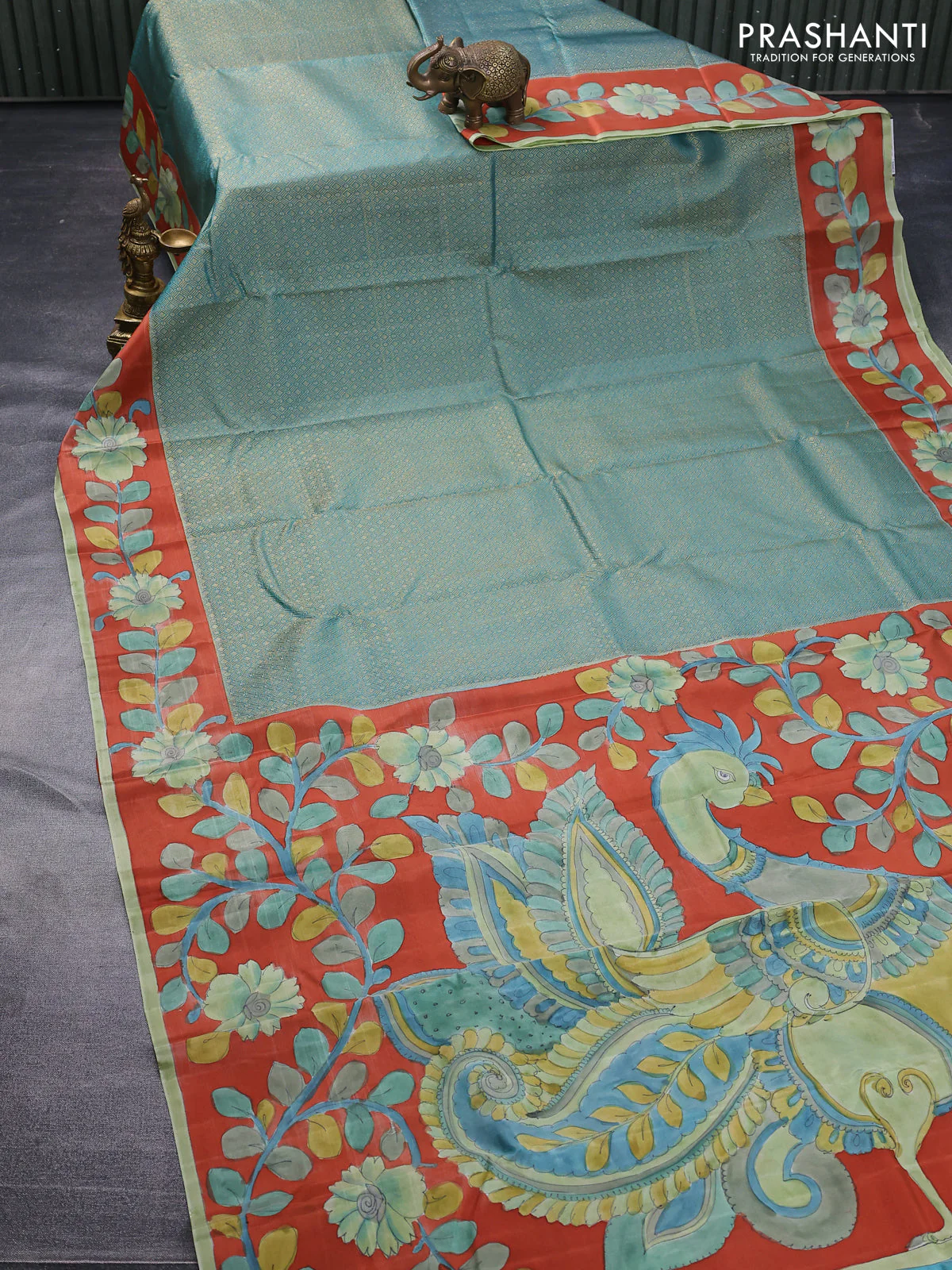 Pure kanchipuram silk saree teal blue and rustic orange with allover zari woven geometric brocade weaves and kalamkari printed pallu & border - Image 2