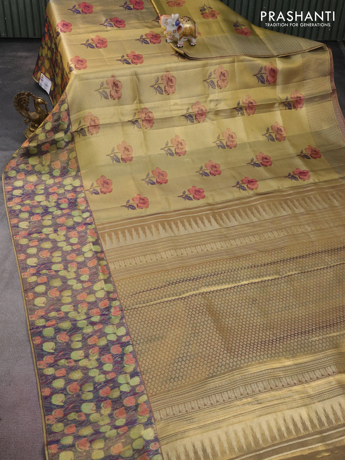 Pure kanchipuram tissue silk saree gold and navy blue with floral design motif and long rich floral design border - Image 2