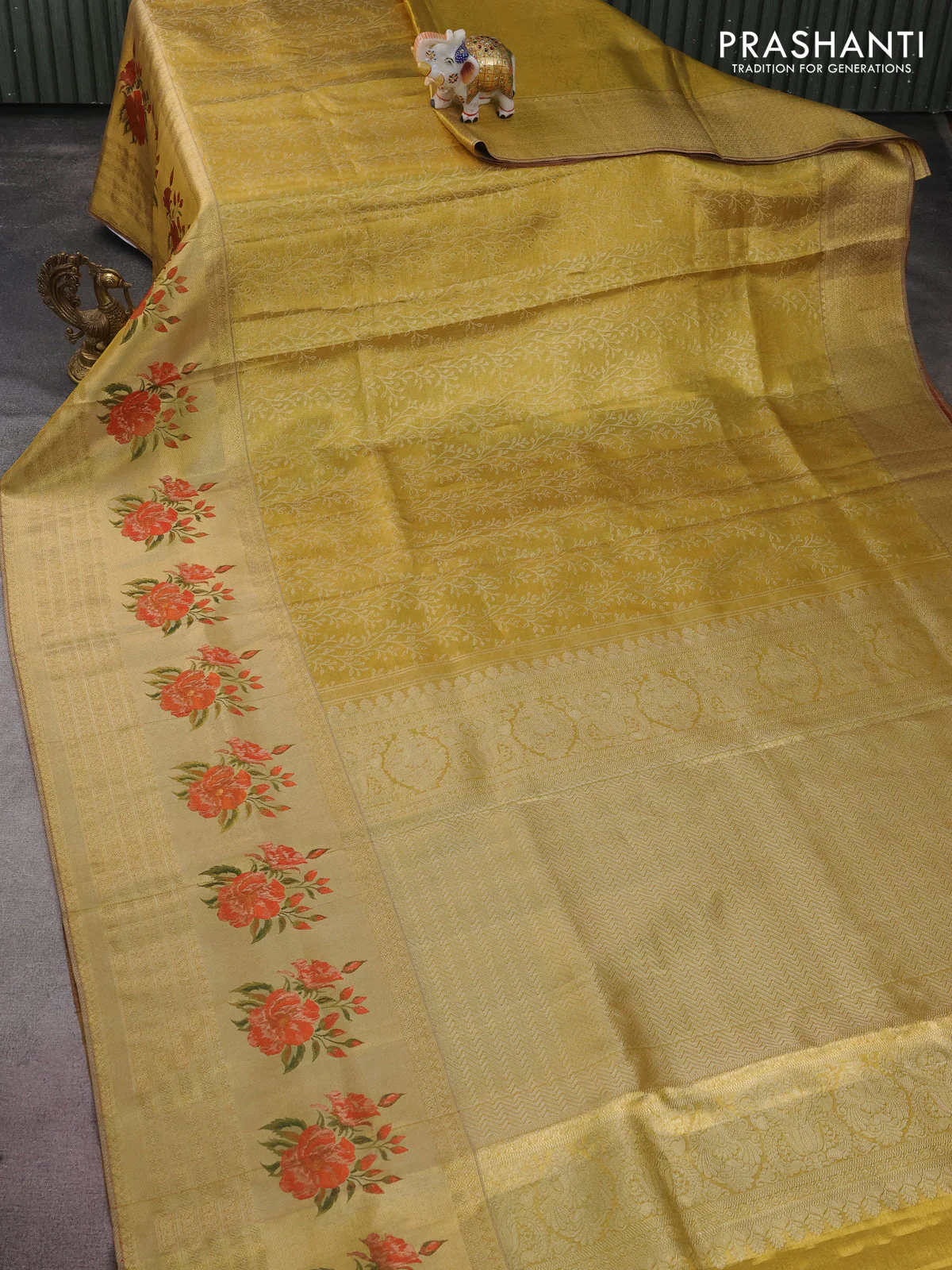 Pure kanchipuram tissue silk saree gold and red with allover zari weaves and floral design butta border - Image 6