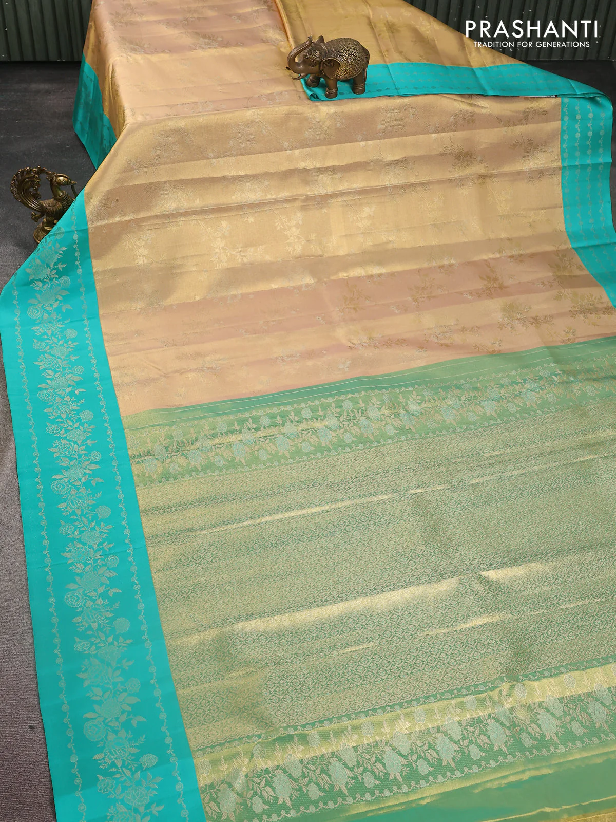 Pure kanchipuram Tissue silk saree gold and teal green with allover zari weaves and floral design zari border - Image 2