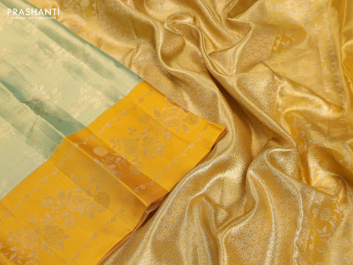 Pure kanchipuram Tissue silk saree pista green and mustard yellow with allover zari weaves and floral design zari border - Image 3