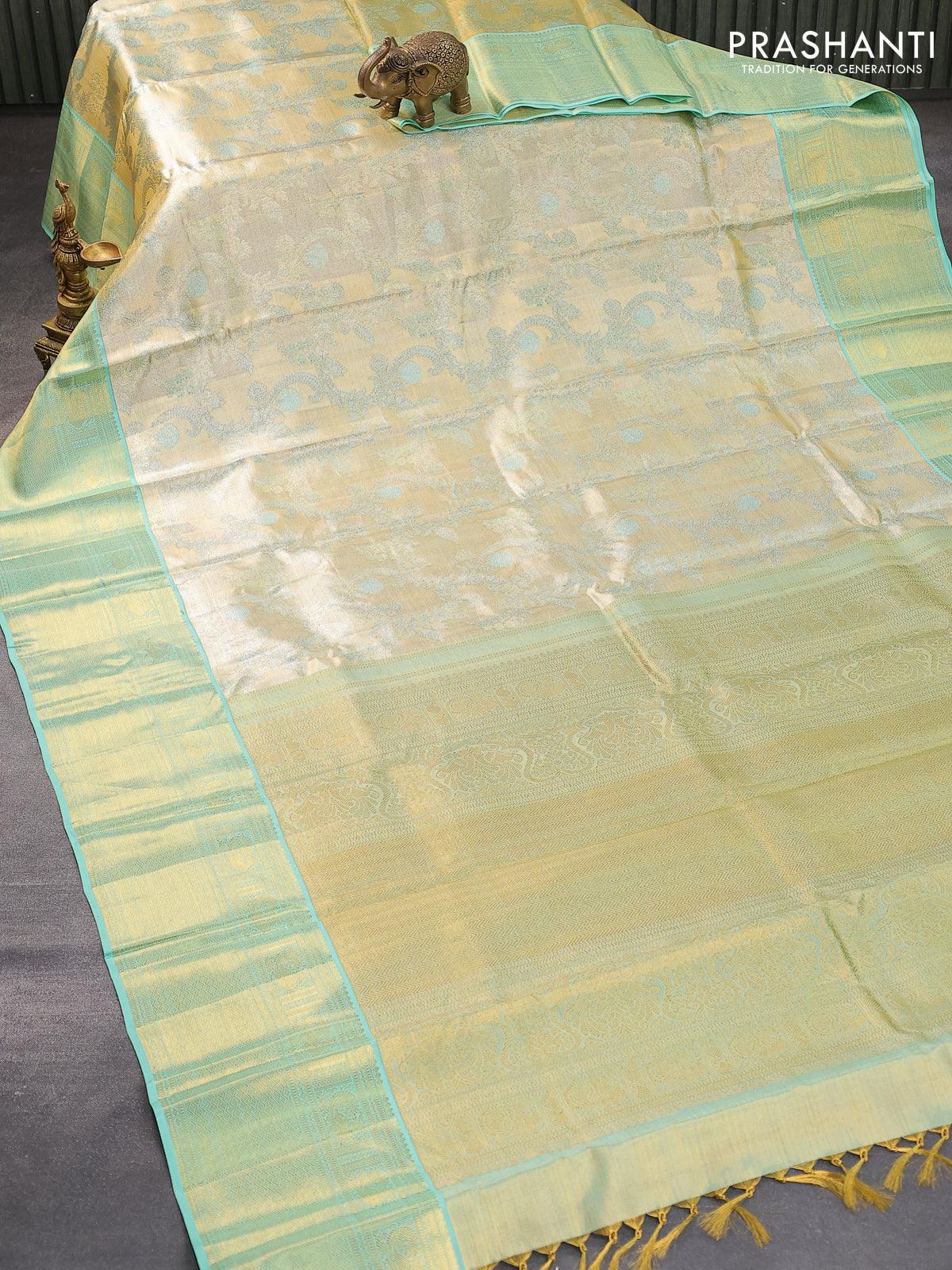 Pure kanjivaram tissue silk saree cream and teal blue with allover zari woven brocade weaves and zari woven border - Image 6