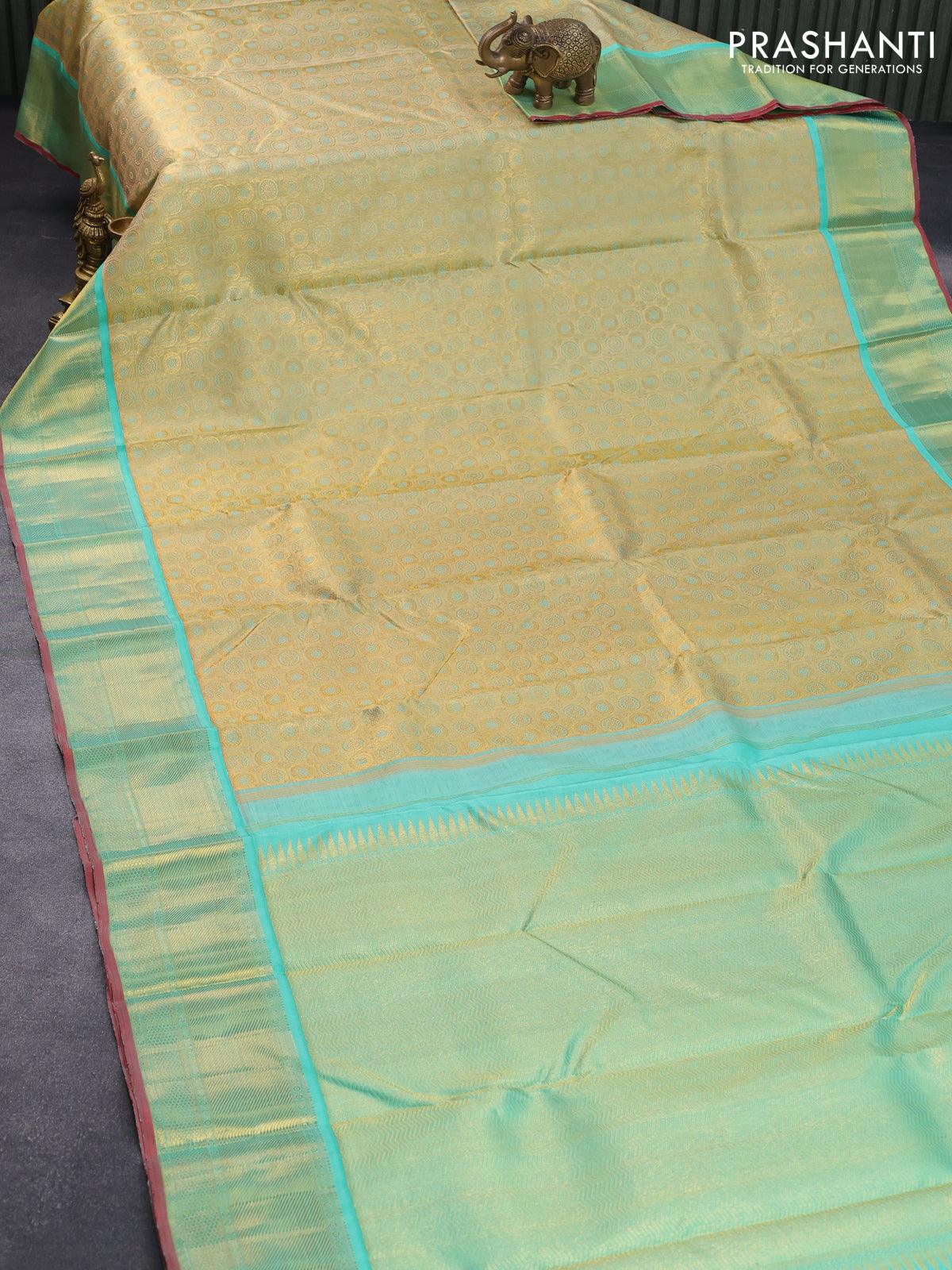 Pure kanjivaram tissue silk saree gold and teal blue with allover rudhraksha zari woven brocade weaves and rich zari woven border - Image 2
