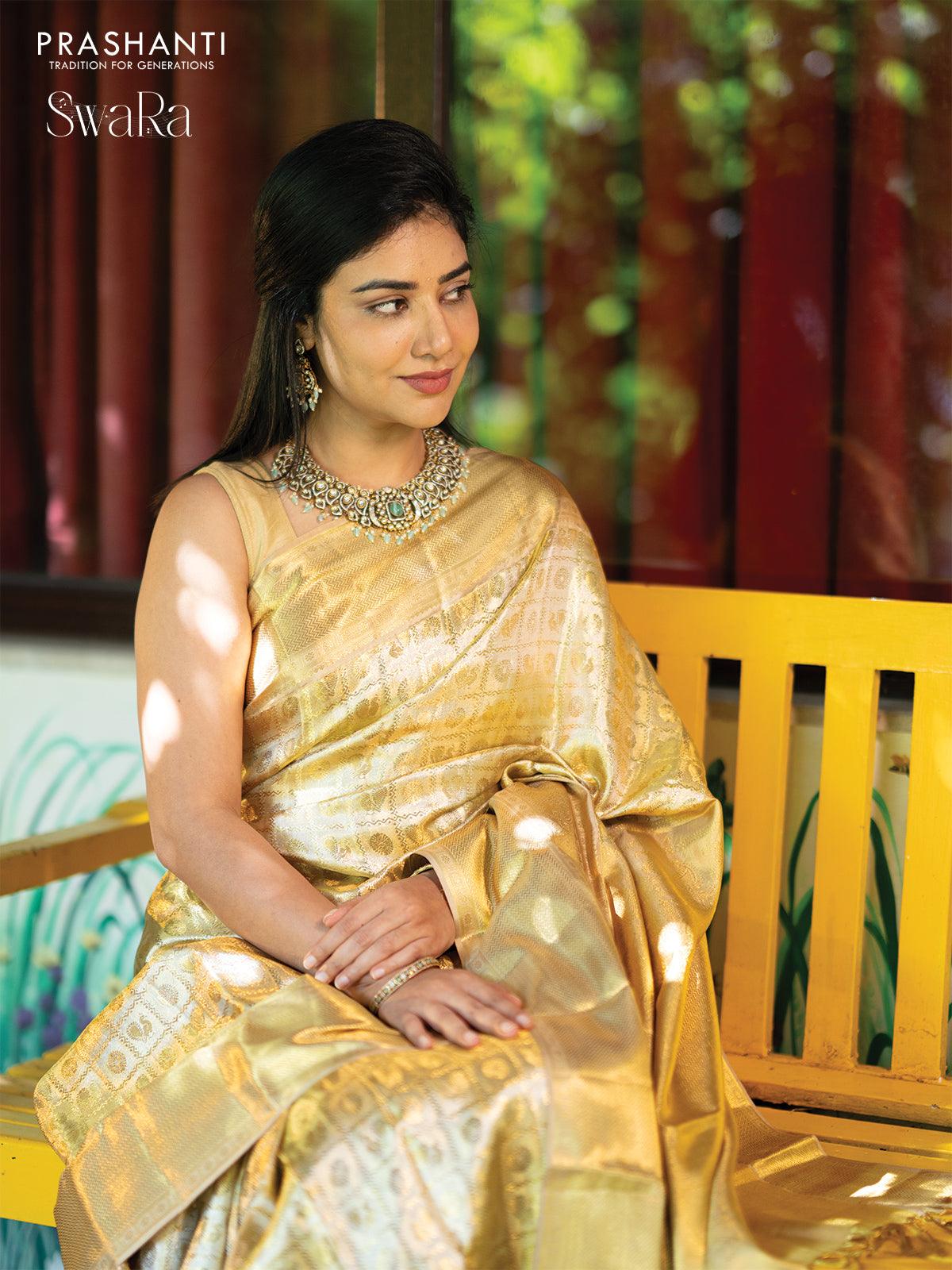 Pure kanjivaram tissue silk saree gold with allover zari woven brocade weaves and long zari woven border - Image 4