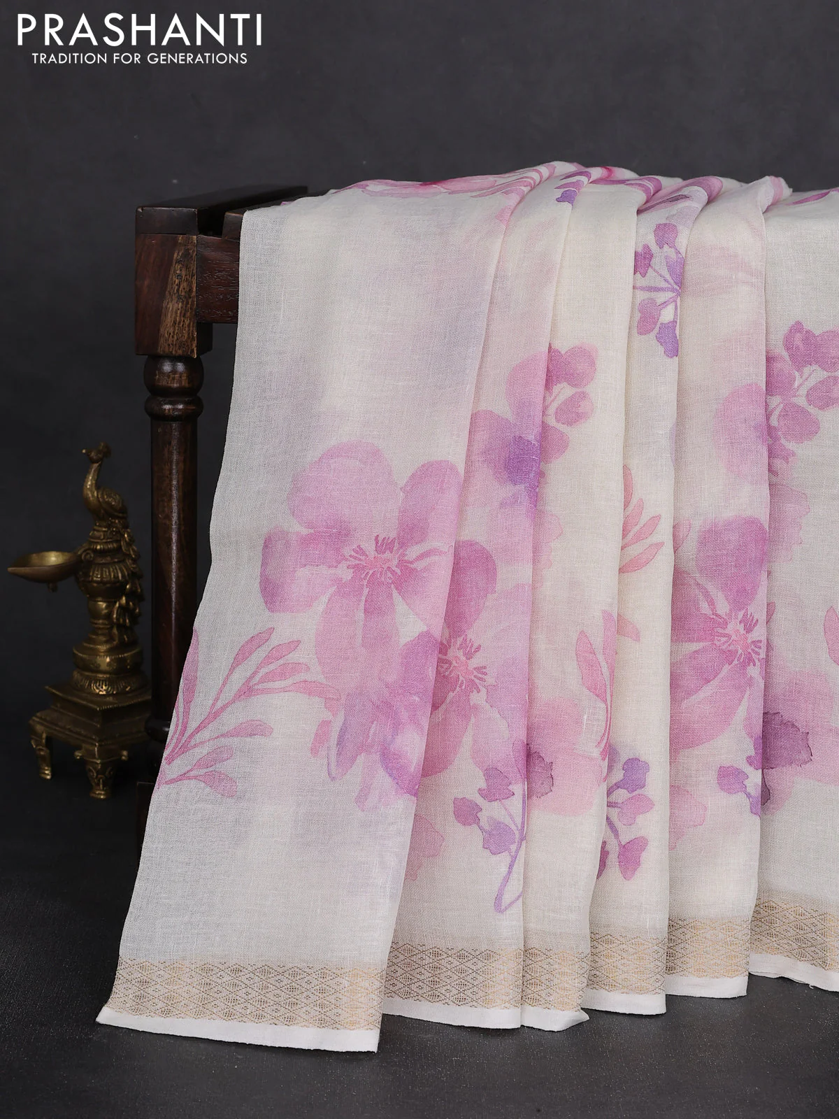 Pure linen saree cream and mild lavender with allover flower prints and zari woven border - Image 2