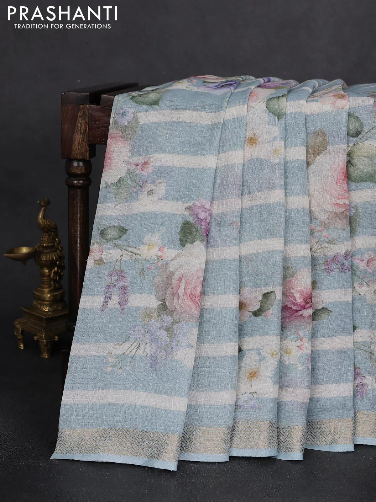 Pure linen saree teal blue and off white with allover flower prints and zari woven border - Image 2