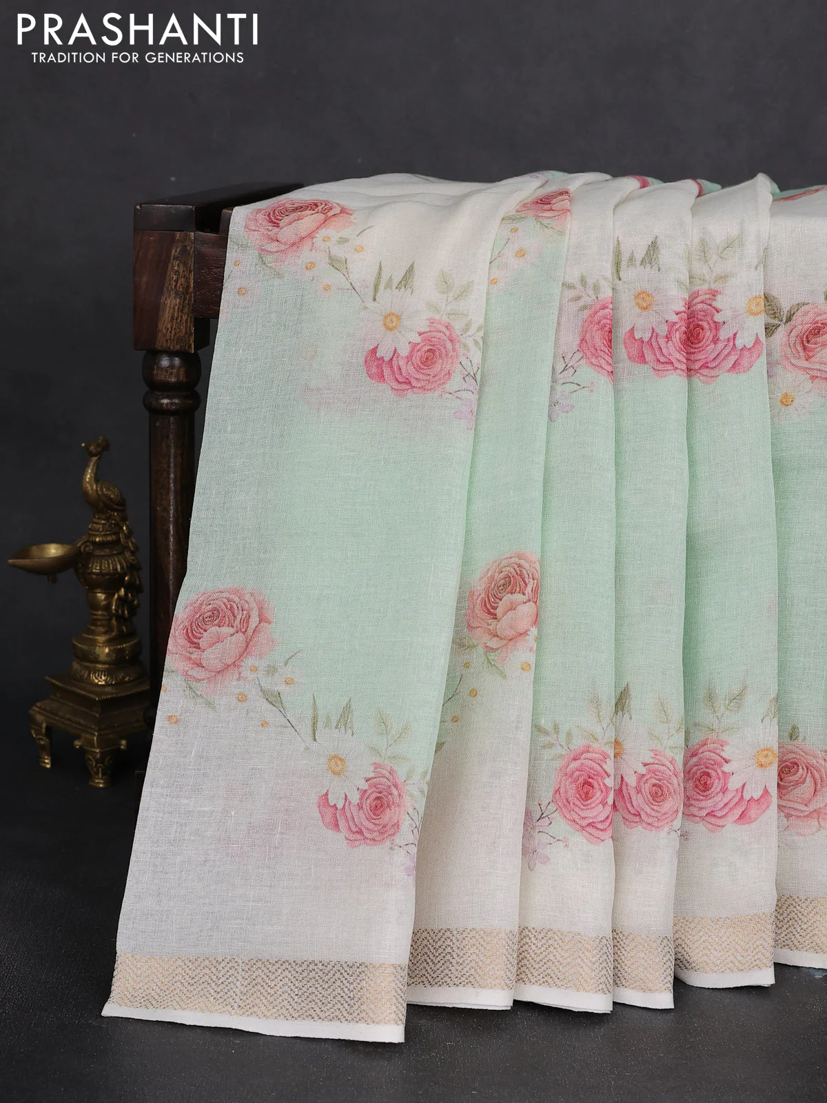 Pure linen saree teal green and cream with allover flower prints and zari woven border - Image 2