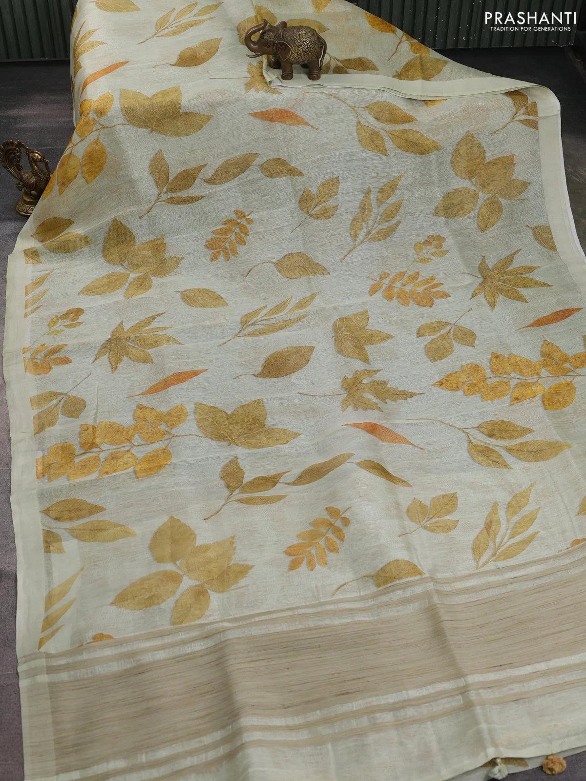 Pure linen silk saree mild pista green and mustard yellow with allover prints and simple border - Image 2