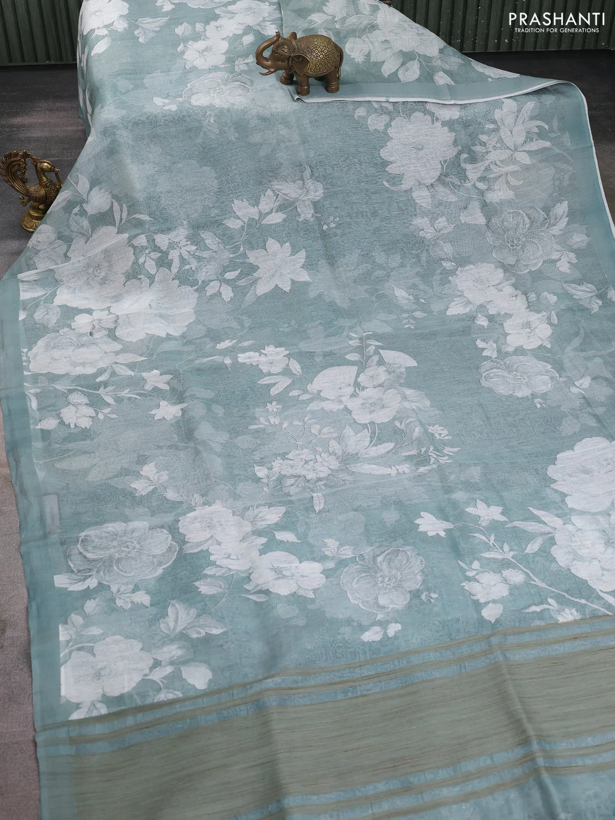 Pure linen silk saree pastel green shade with allover floral prints and simple border - Image 2