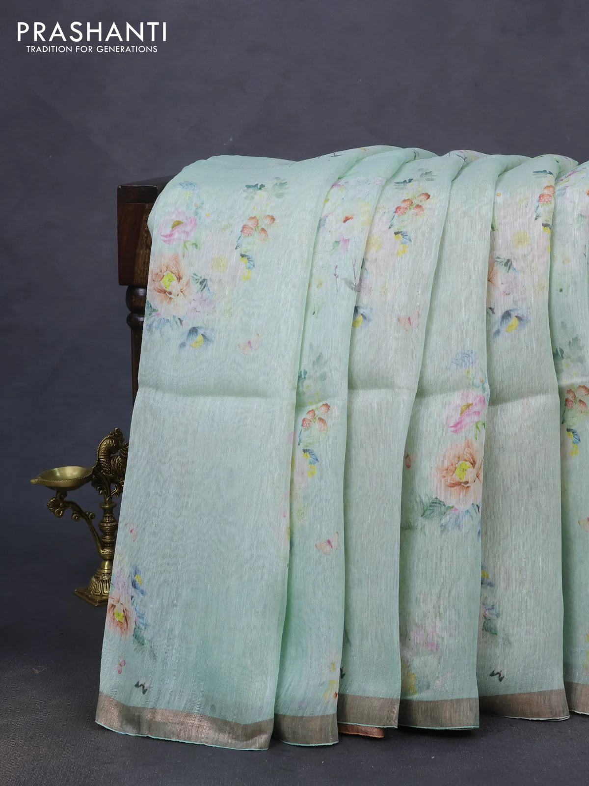 Pure linen silk saree teal shade and sandal with floral butta prints and small zari woven border