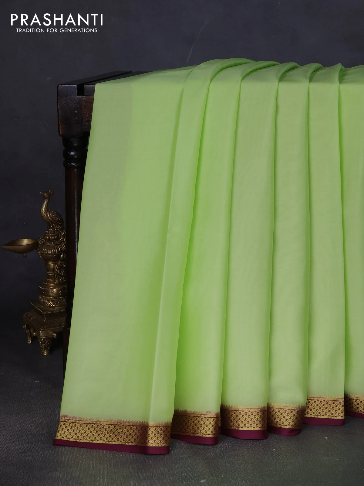Pure mysore silk saree fluorescent green and wine shade with plain body and zari woven border