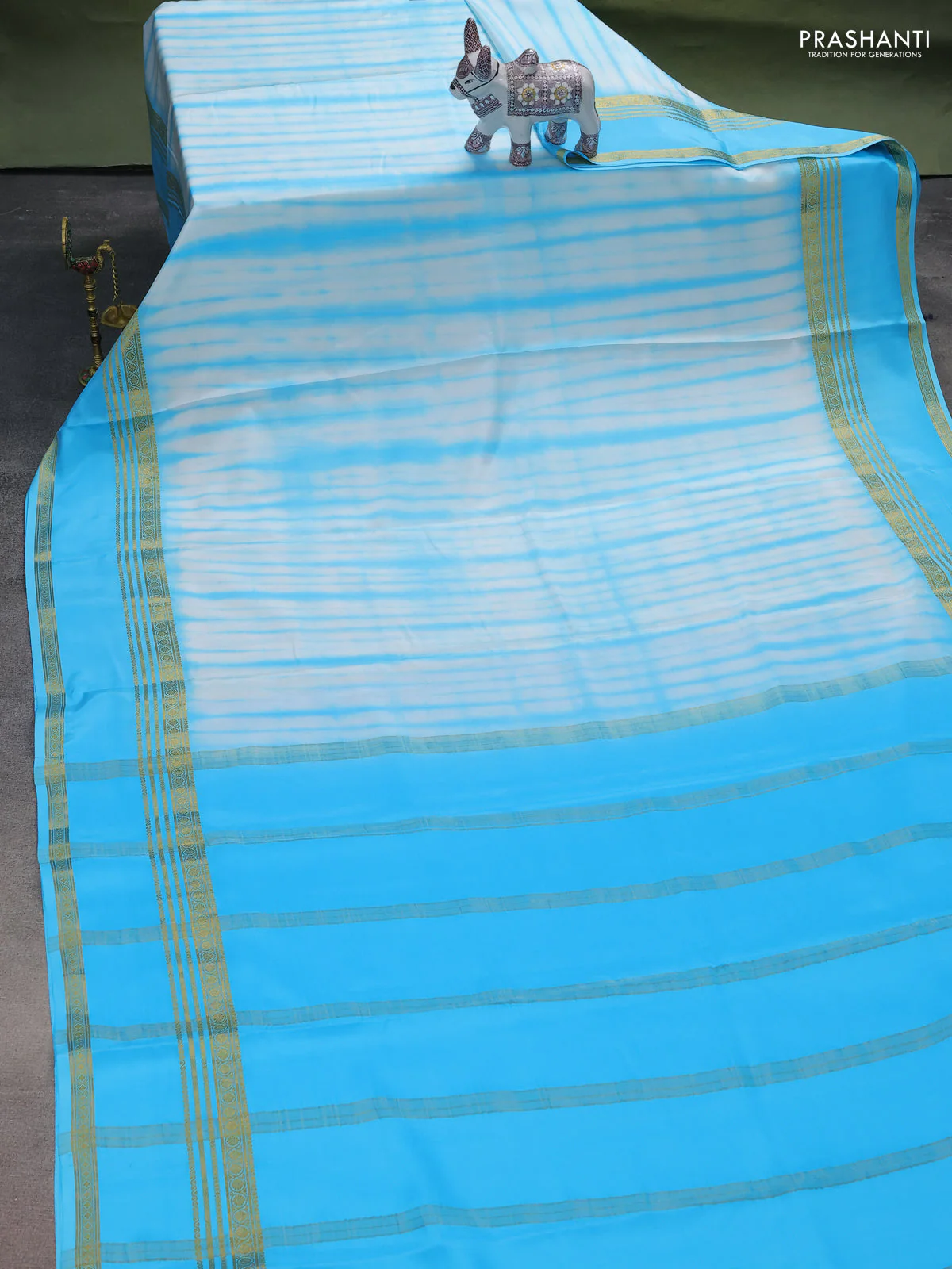 Pure mysore silk saree off white and light blue with allover shibori prints and rettapet zari woven border - Image 2