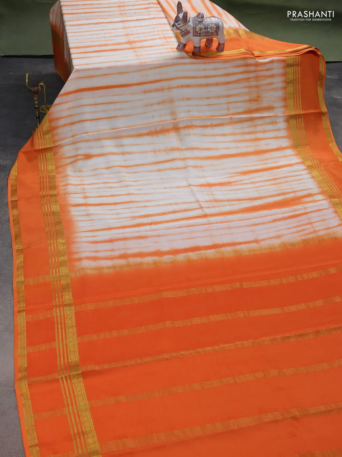 Pure mysore silk saree off white and orange with allover shibori prints and rettapet zari woven border - Image 2