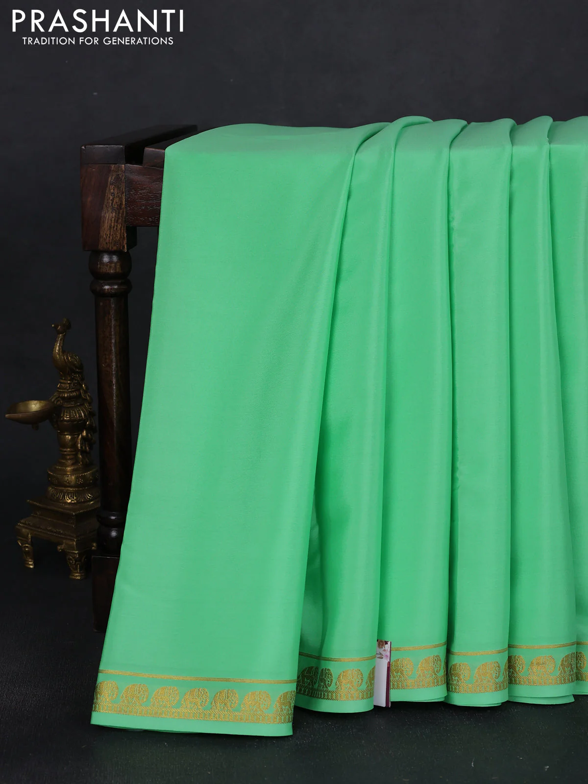 Pure mysore silk saree teal green with plain body and elephant zari woven border
