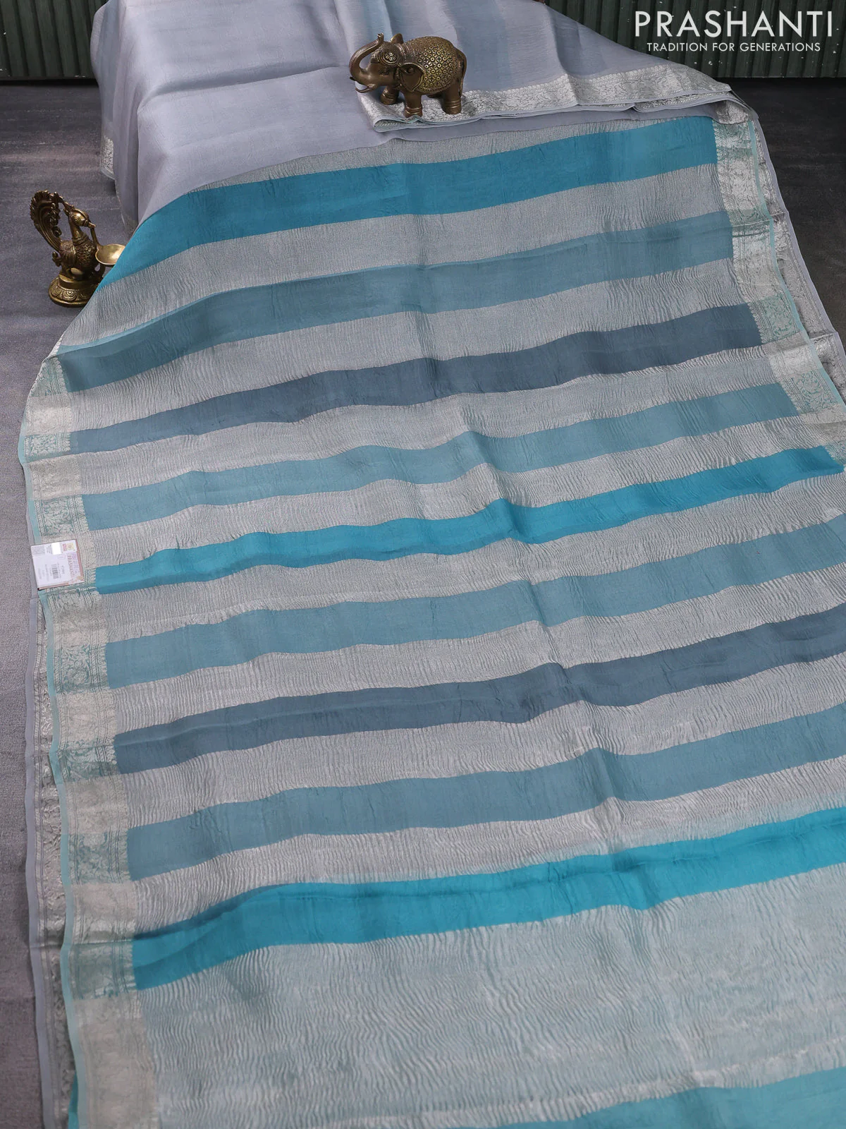 Pure organza partly silk saree pastel blue with silver zari stripe pattern and silver zari woven border - Image 3