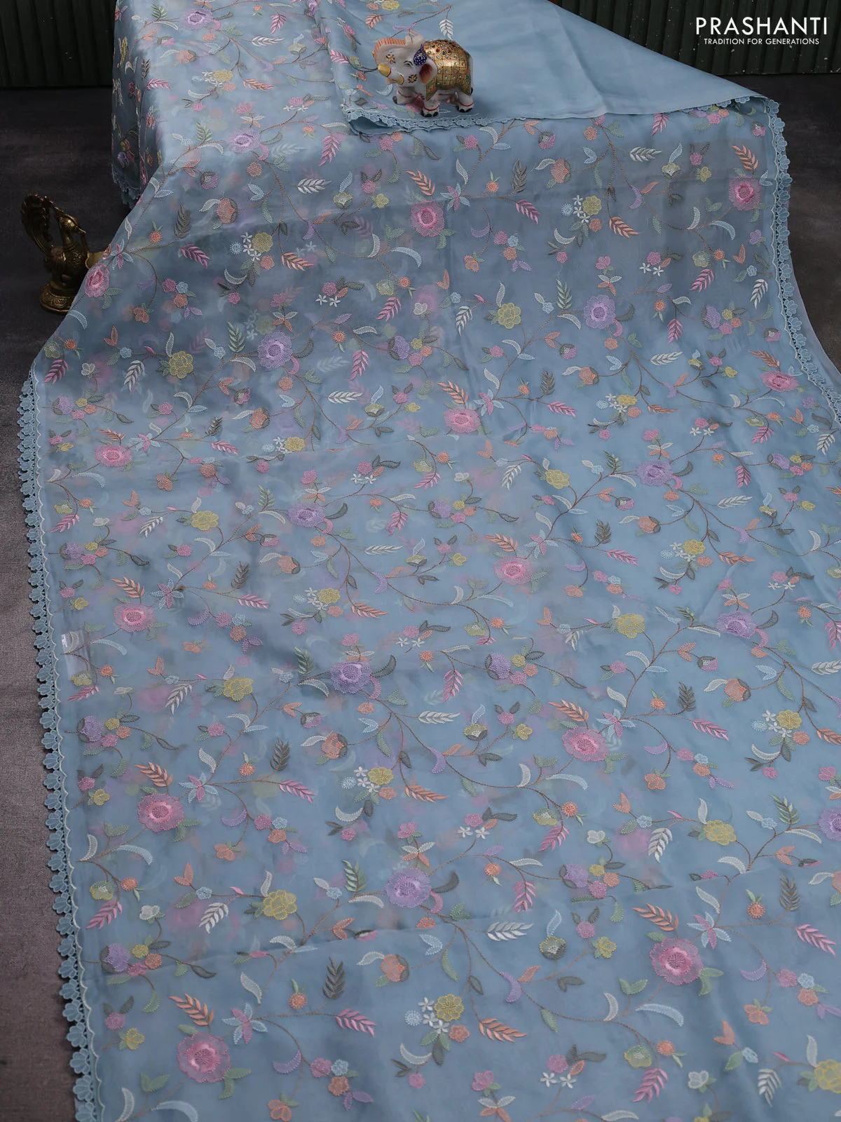 Pure organza silk saree blue shade with floral embroidery work and lace work border - Image 2