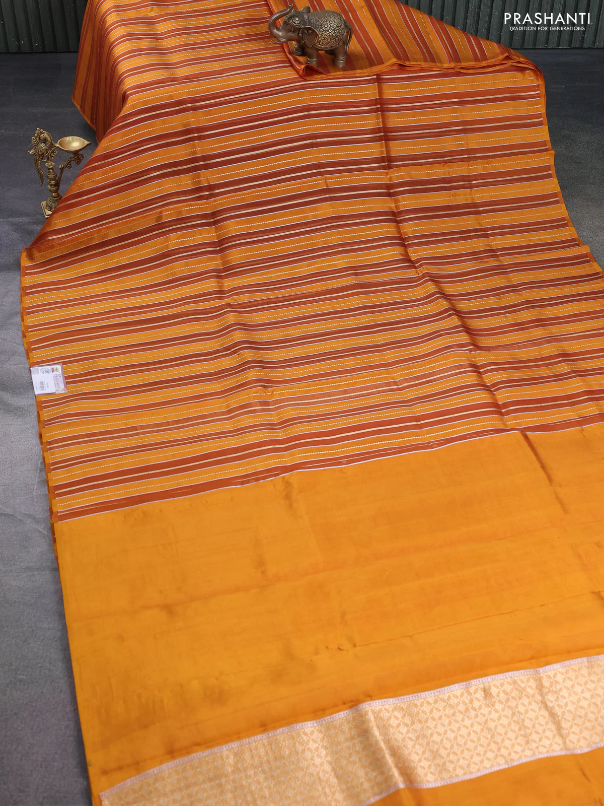 Pure organza silk saree dark mustard with allover zari woven stripes pattern in borderless style - Image 2