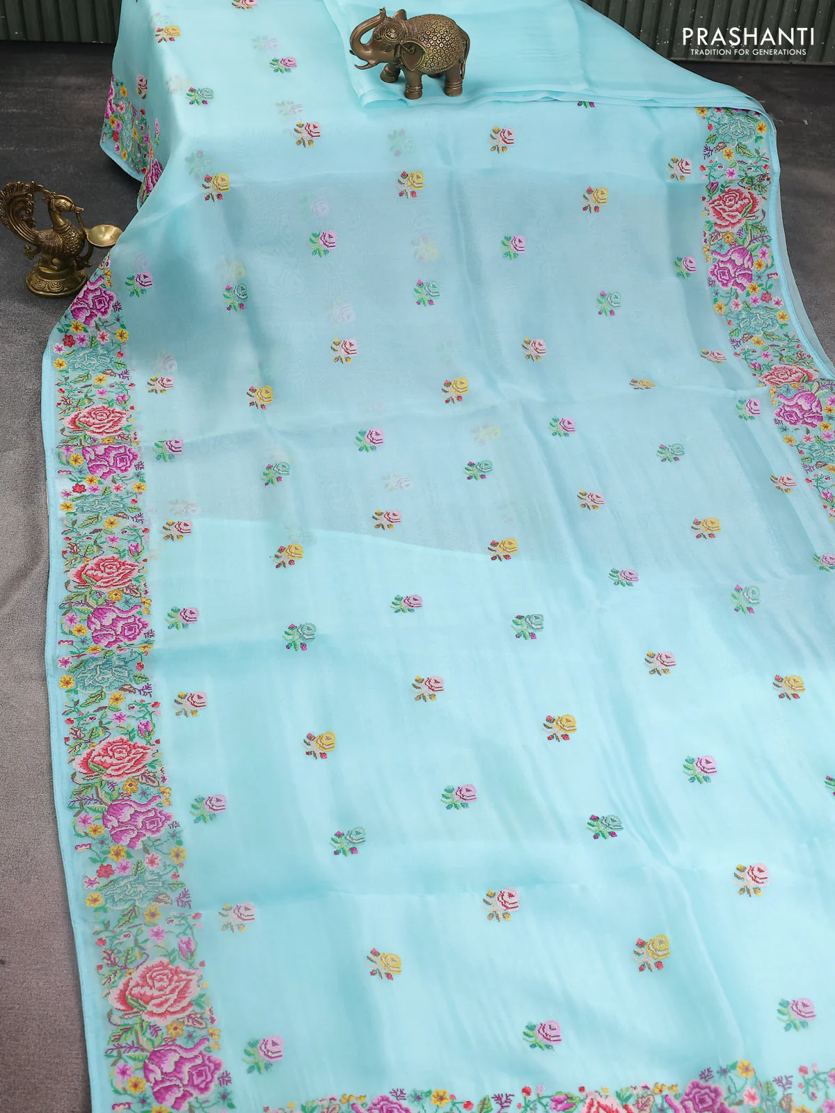 Pure organza silk saree light blue with embroidery work buttas and floral design embroidery border - Image 2