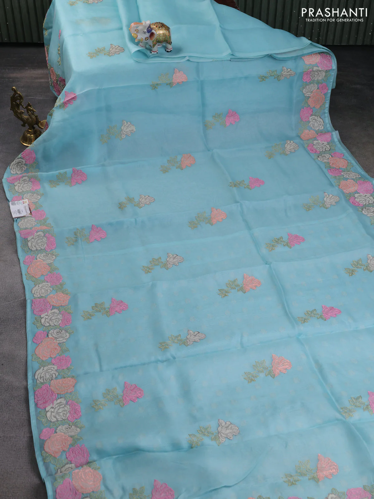 Pure organza silk saree light blue with floral embroidery buttas and floral embroidery border - Image 2