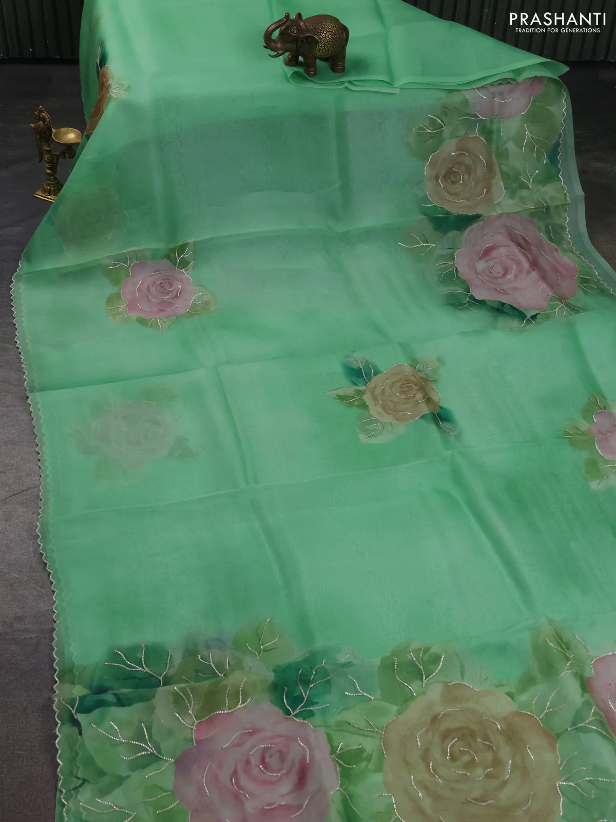 Pure organza silk saree light green with floral embroidery buttas and floral embroidery border - Image 2