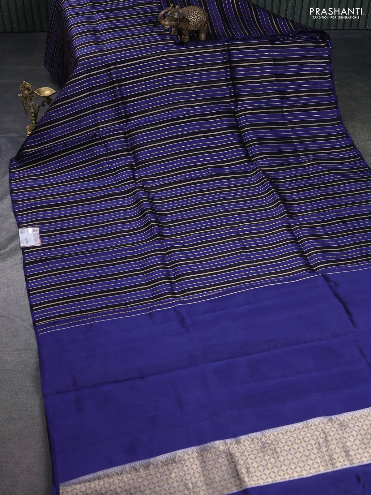 Pure organza silk saree navy blue and blue with allover zari woven stripes pattern in borderless style - Image 2