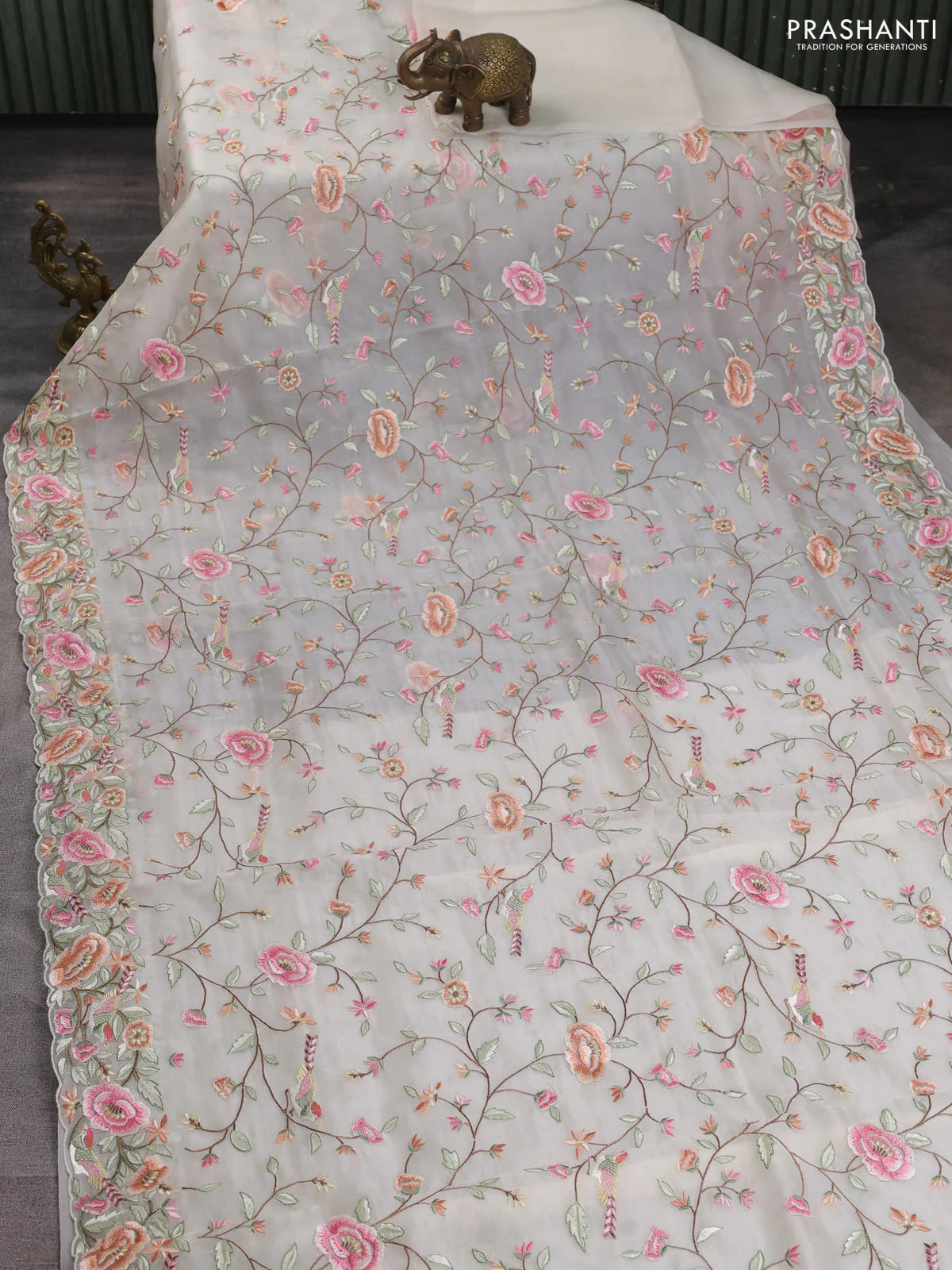 Pure organza silk saree off white with allover embroidery work and floral embroidery border - Image 2