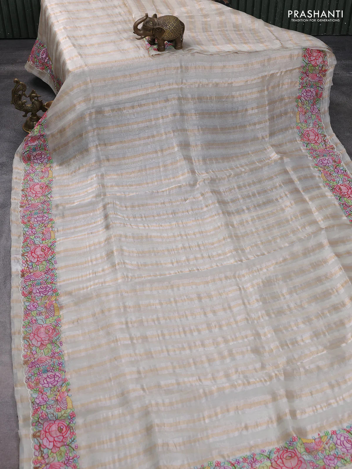 Pure organza silk saree off white with allover zari stripe pattern & zardosi work and embroidered border - Image 2