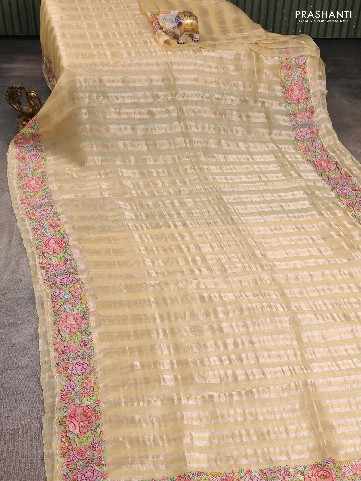Pure organza silk saree pale yellow with allover silver & gold stripes pattern and embroidered border - Image 2