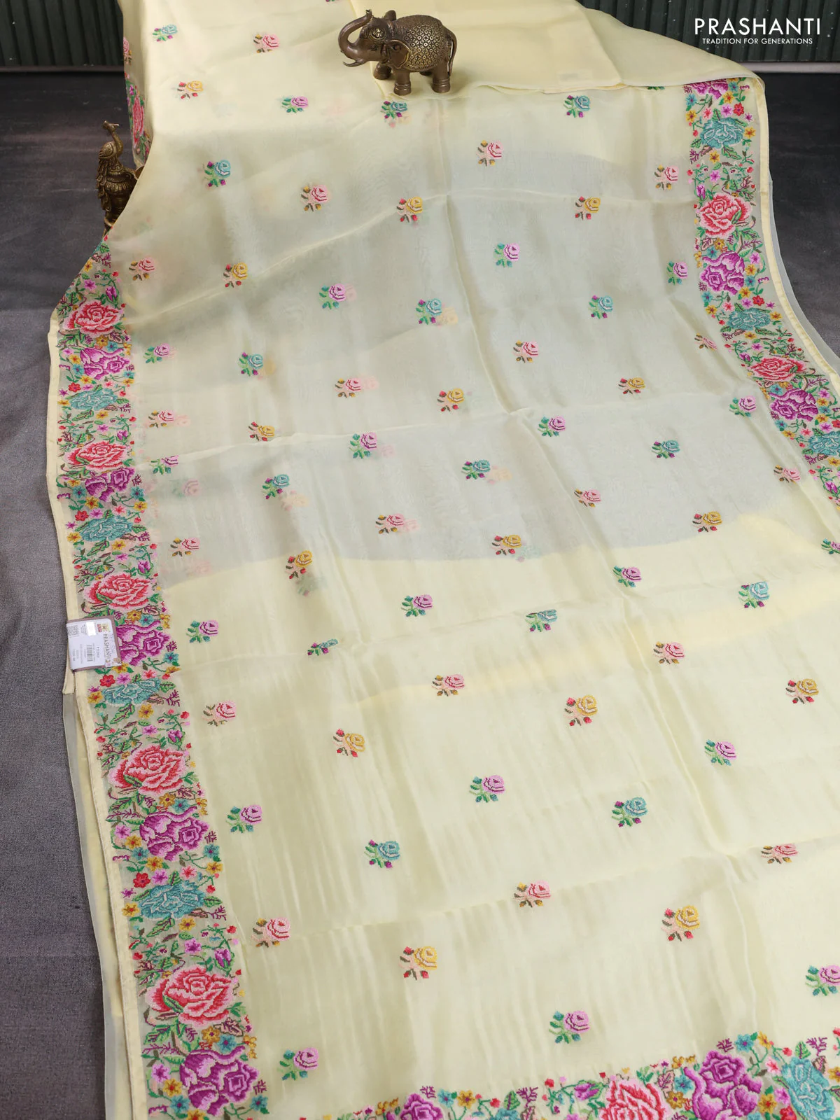 Pure organza silk saree pale yellow with embroidery buttas and petite embroidery border - Image 2