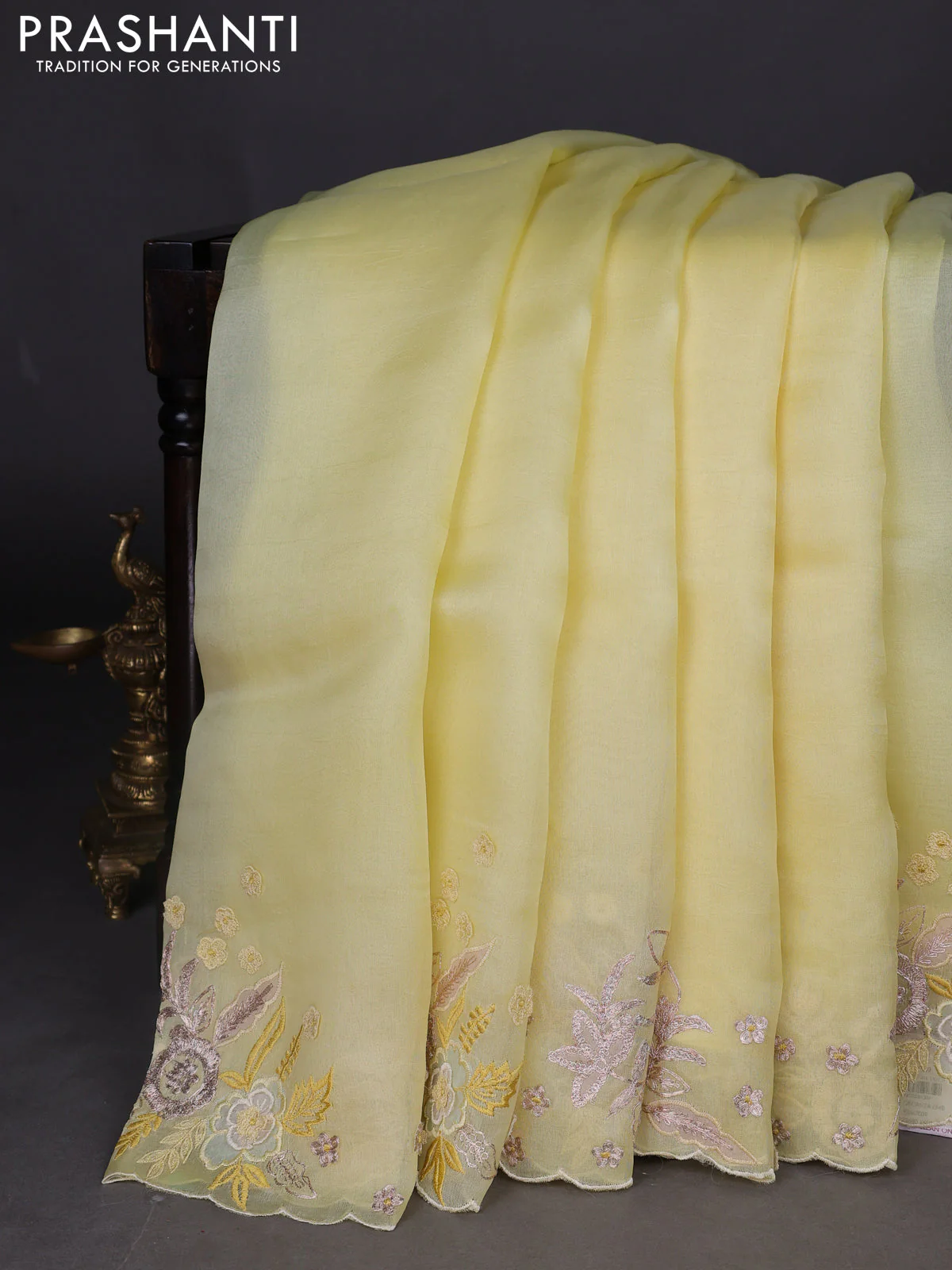 Pure organza silk saree pale yellow with plain body and embroidery border