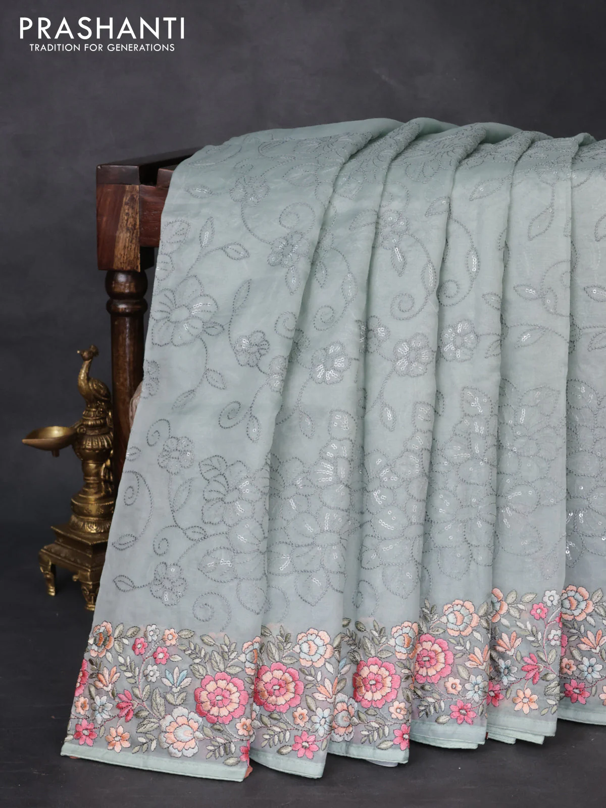 Pure organza silk saree pastel blue shade with allover embroidery and floral embroidery border